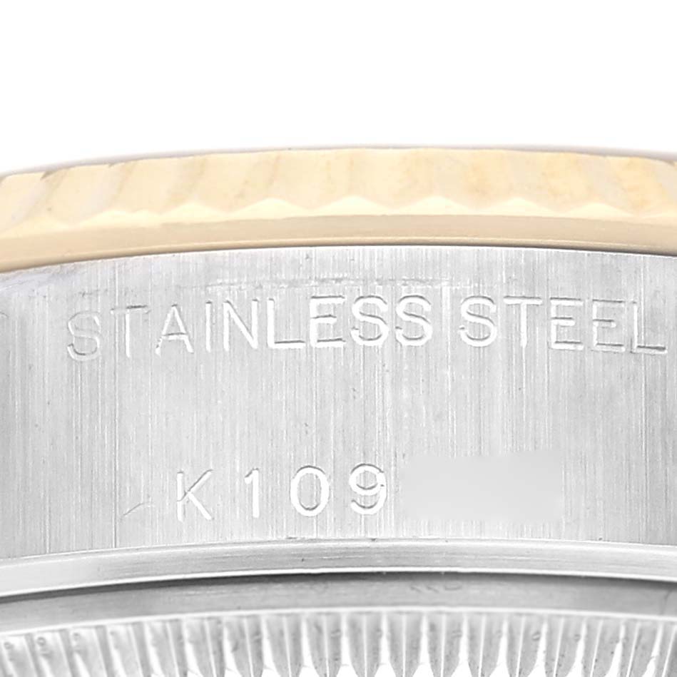 The image shows the side of the watch case of a Rolex Datejust 79173 Women
s Steel and Gold (two tone) Champagne Dial 79173 Women
s Steel and Gold (two tone) Champagne Dial, highlighting the stainless steel material and part of the bezel edge.