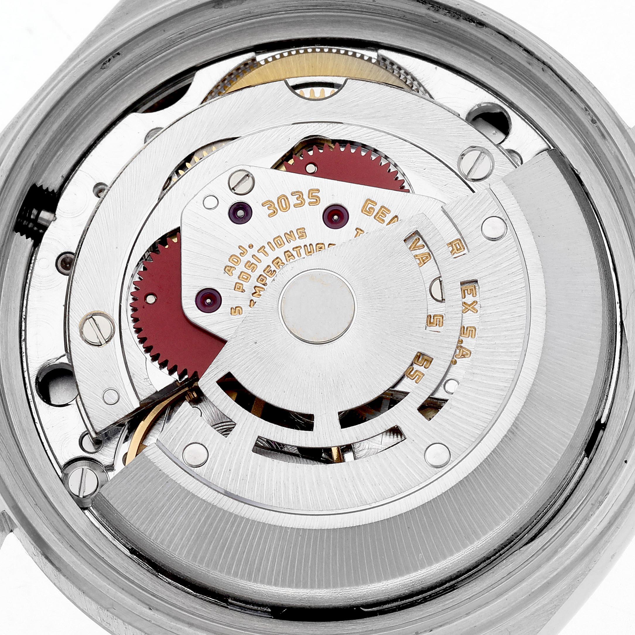 The image shows the internal movement of the Rolex Datejust 16013 Men
s Steel and Gold (two tone) Champagne Dial 16013 Men
s Steel and Gold (two tone) Champagne Dial watch viewed from the back, displaying gears and inscriptions.