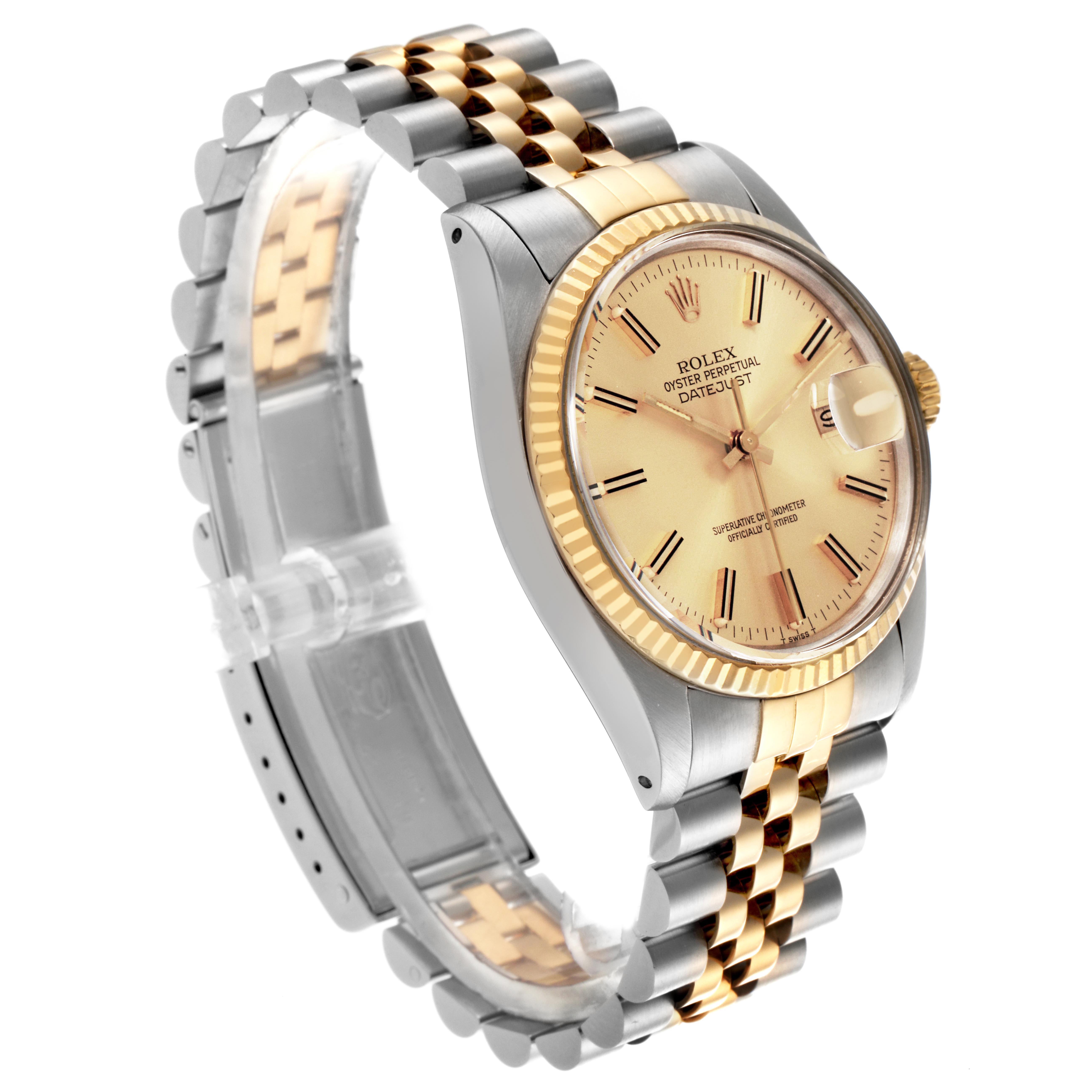 The Rolex Datejust 16013 Men
s Steel and Gold (two tone) Champagne Dial 16013 Men
s Steel and Gold (two tone) Champagne Dial is shown at a slight angle, highlighting its face, case, and two-tone bracelet.