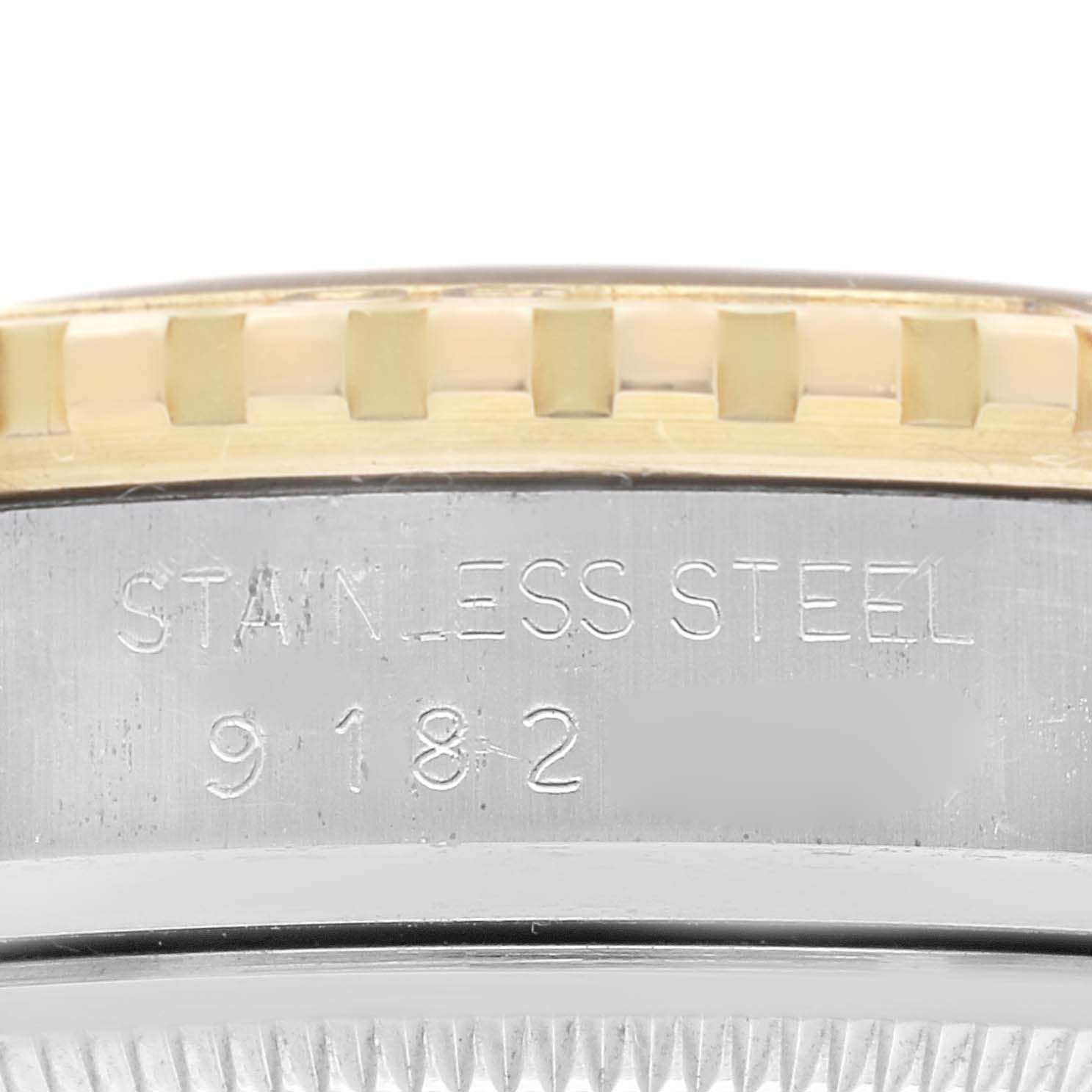 This close-up image shows the stainless steel casing and part of the bezel of the Rolex Vintage Collection 16253 Men's Steel and Gold (two tone) Black Dial 16253 Men's Steel and Gold (two tone) Black Dial watch, model 9182.