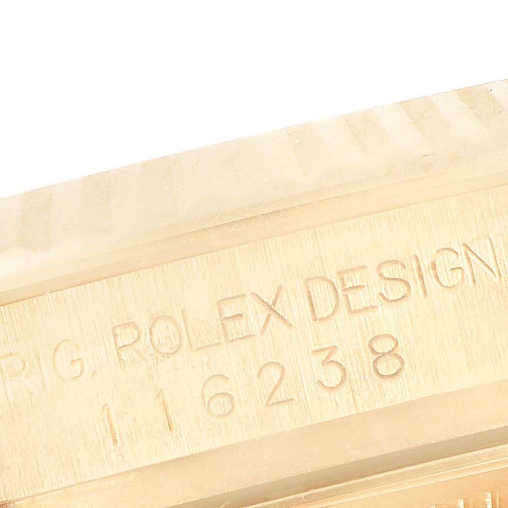 This close-up image shows the model number engraving on the case of a Rolex President 116238 Men
s Yellow Gold Champagne Dial 116238 Men
s Yellow Gold Champagne Dial watch.
