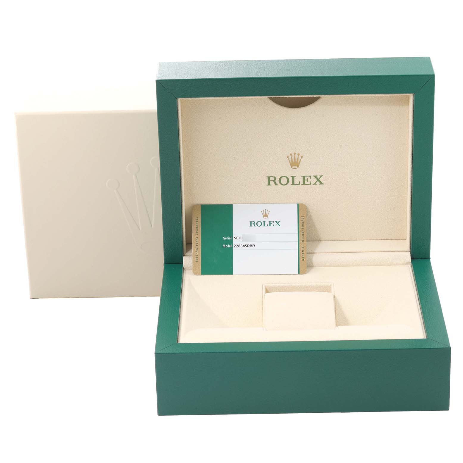 The image shows an open green and beige Rolex box for the President model, including a warranty card.