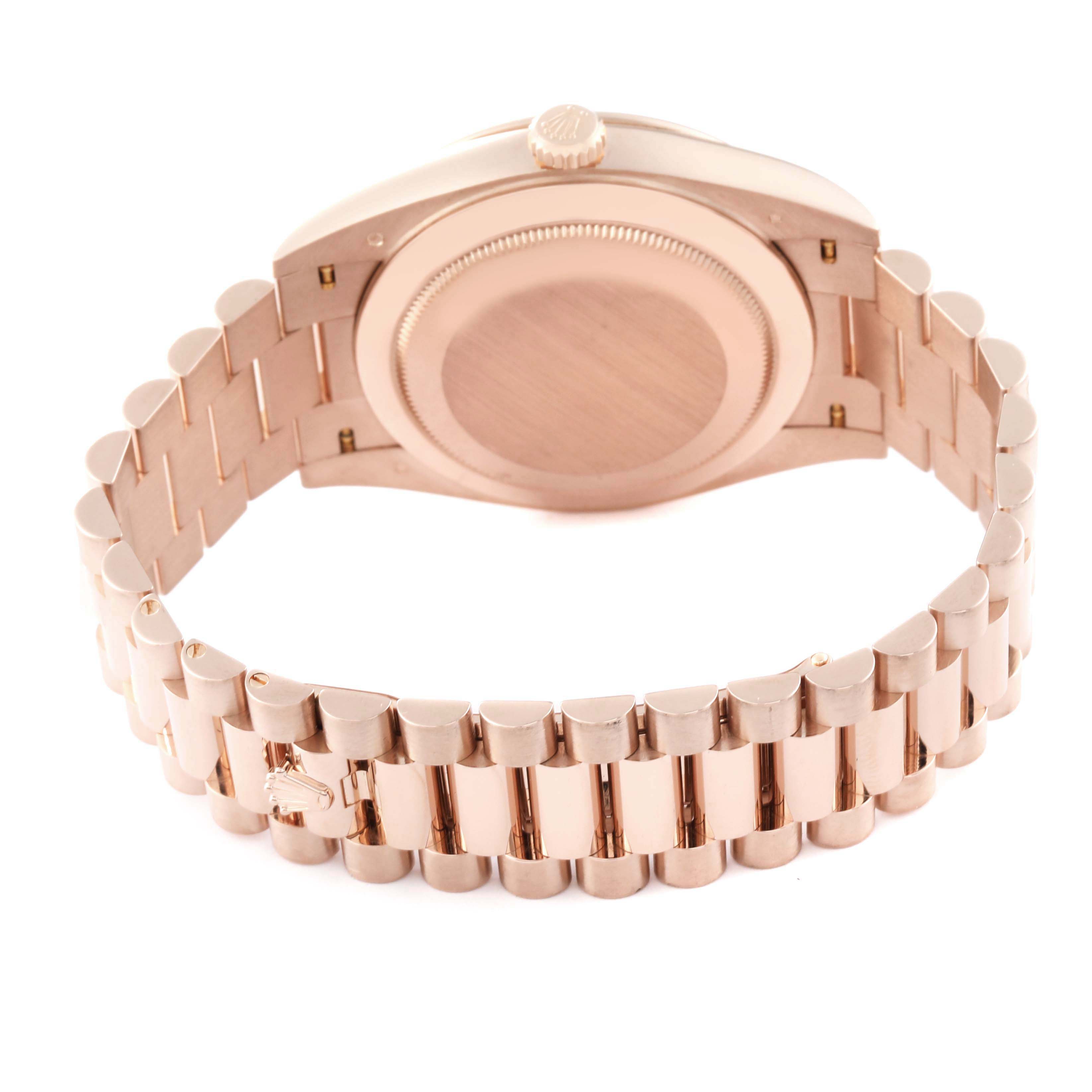 This image shows the back and bracelet of a Rolex President 228345 Men's Rose Gold Green Dial 228345 Men's Rose Gold Green Dial model watch from a slightly angled overhead view.