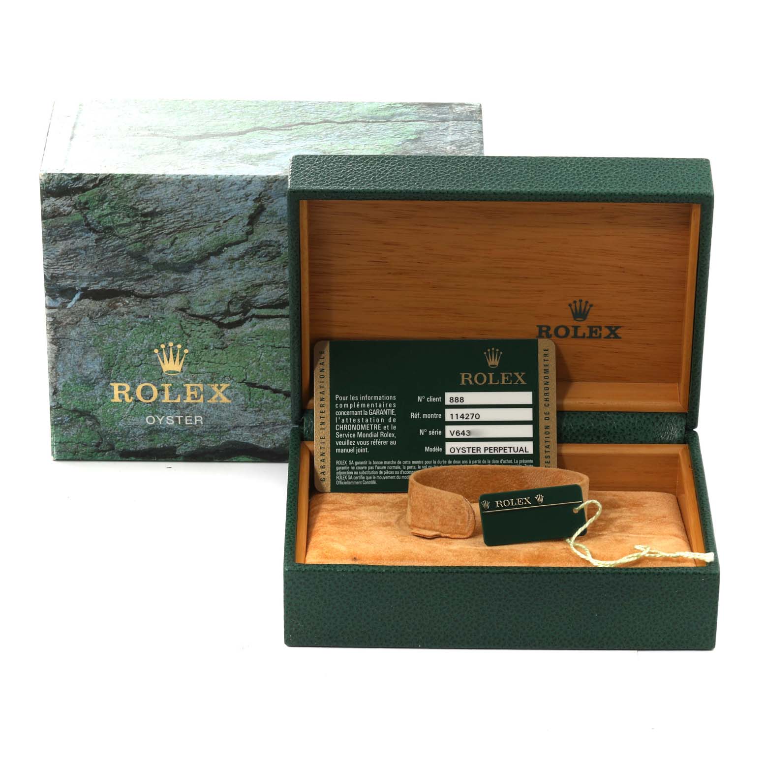 This image shows the box and packaging for a Rolex Explorer 114270 Men
s Stainless Steel Black Dial 114270 Men
s Stainless Steel Black Dial model watch, including the warranty card and tag.
