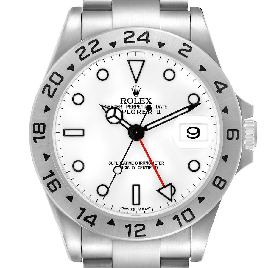 The Rolex Explorer II watch is shown from a front angle, highlighting the white dial, date window, bezel, and bracelet.
