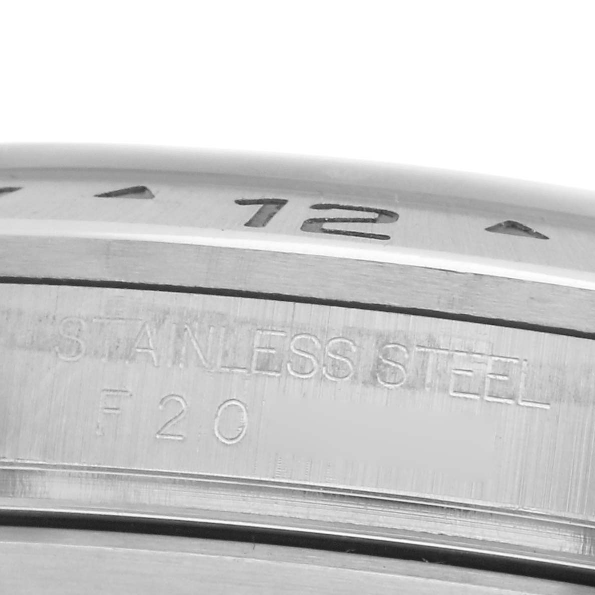 The image shows a close-up of the bezel and case side of a Rolex Explorer 16570 Men
s Stainless Steel White Dial 16570 Men
s Stainless Steel White Dial watch, highlighting the stainless steel material and engraved markings.