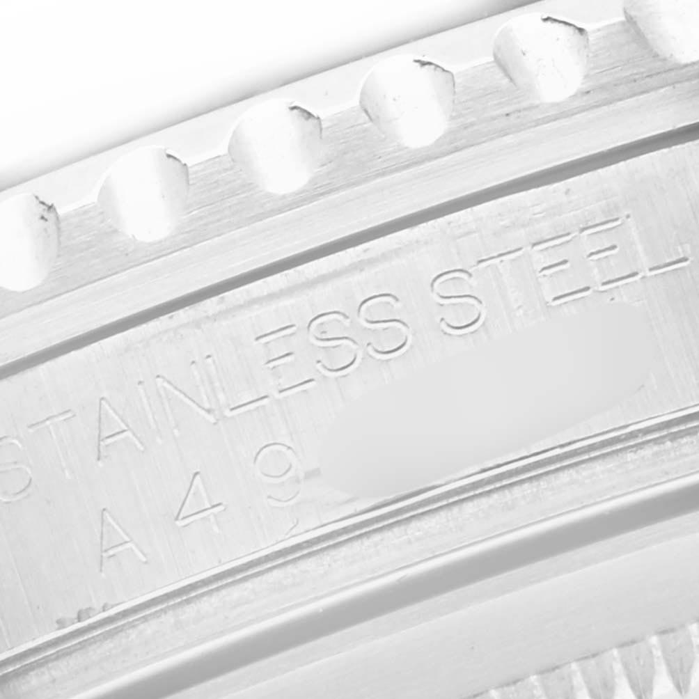 The image shows a close-up of the stainless steel edge and part of the bezel of a Rolex GMT-Master 16710 Men
s Stainless Steel Black Dial 16710 Men
s Stainless Steel Black Dial watch.