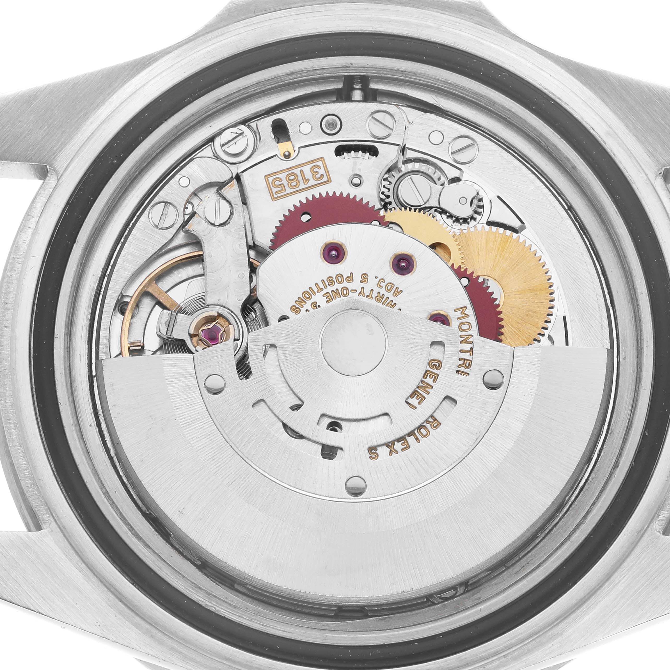 The image shows the movement mechanism of a Rolex GMT-Master 16710 Men
s Stainless Steel Black Dial 16710 Men
s Stainless Steel Black Dial, viewed from the back, highlighting its intricate gears and engravings.