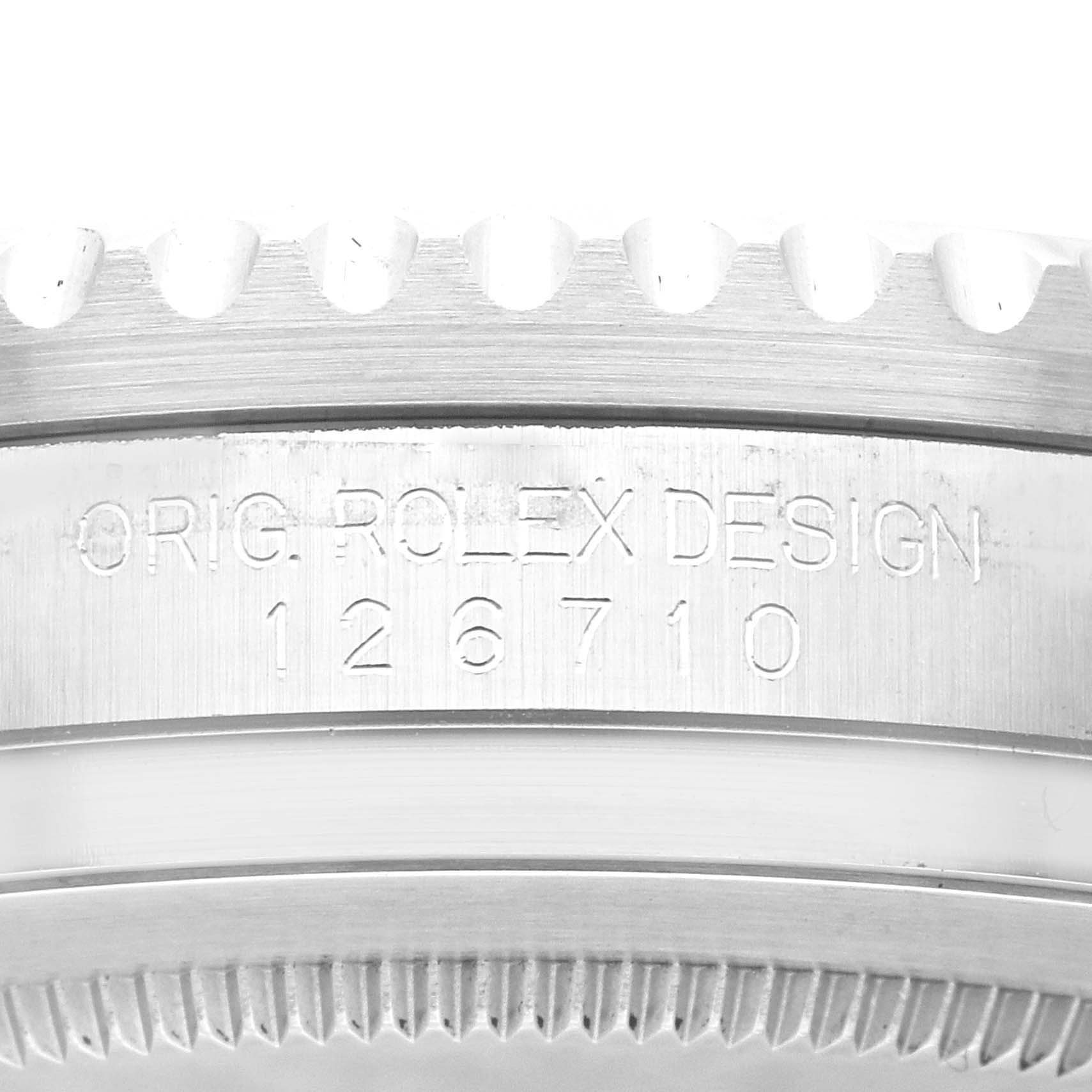 The image shows a close-up of the etched serial number and the bezel edge of a Rolex GMT-Master 126710 Men
s Stainless Steel Black Dial 126710 Men
s Stainless Steel Black Dial model watch.