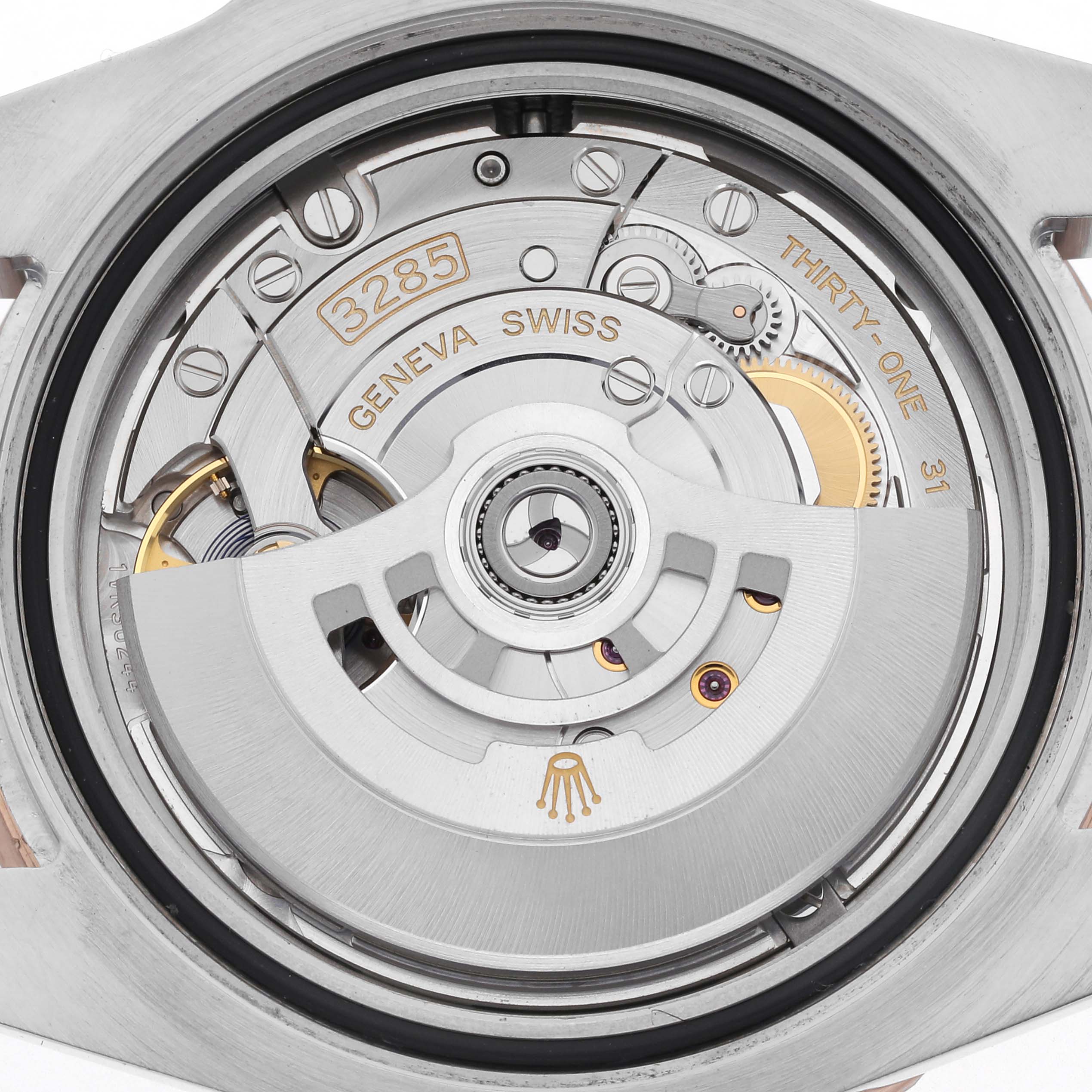 The image shows the back view of a Rolex GMT-Master 126711 Men's Steel and Gold (two tone) Black Dial 126711 Men's Steel and Gold (two tone) Black Dial, displaying the intricate movement components.