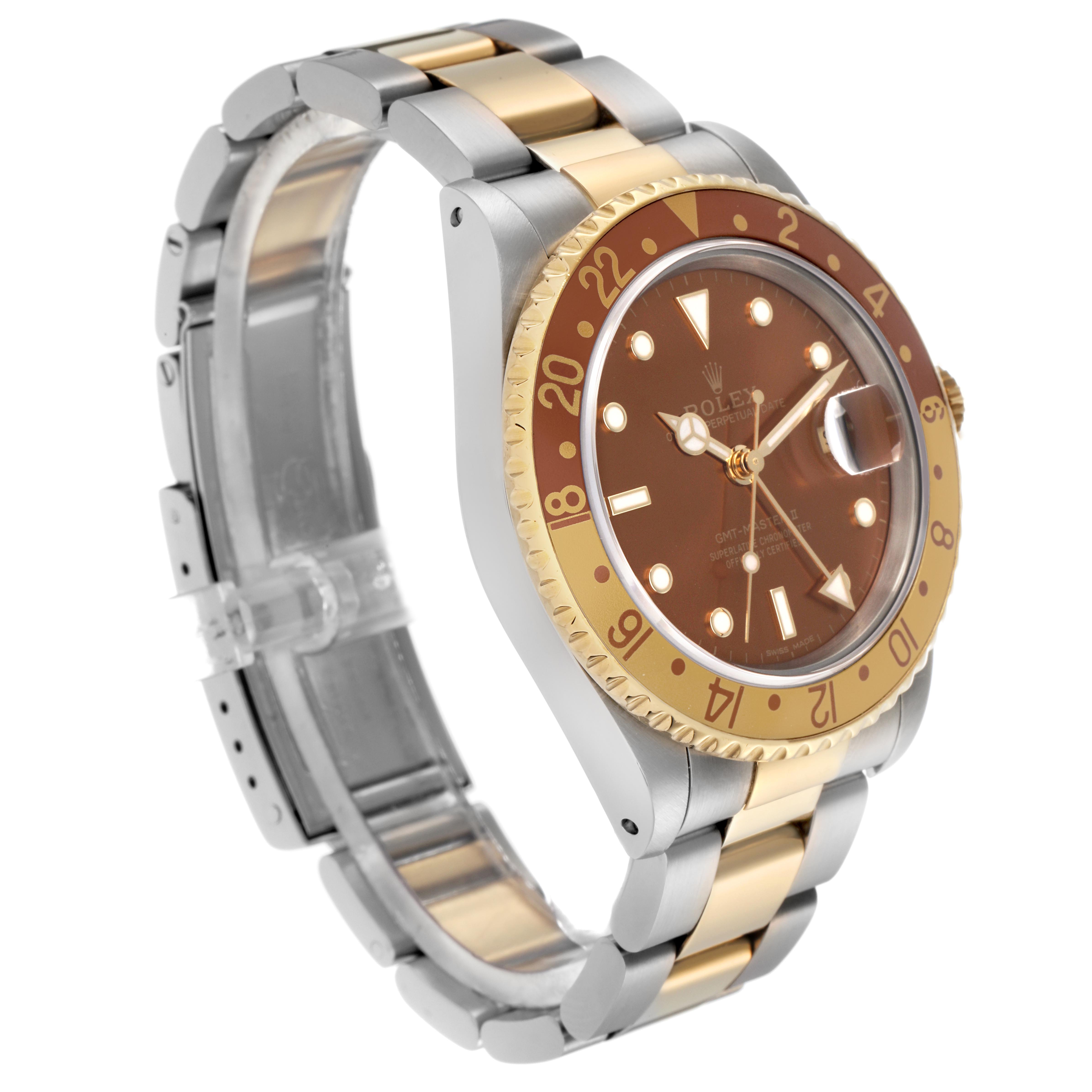 The Rolex GMT-Master 16713 Men's Steel and Gold (two tone) Brown Dial 16713 Men's Steel and Gold (two tone) Brown Dial is shown at a three-quarter angle, highlighting the bezel, dial, and two-tone bracelet.