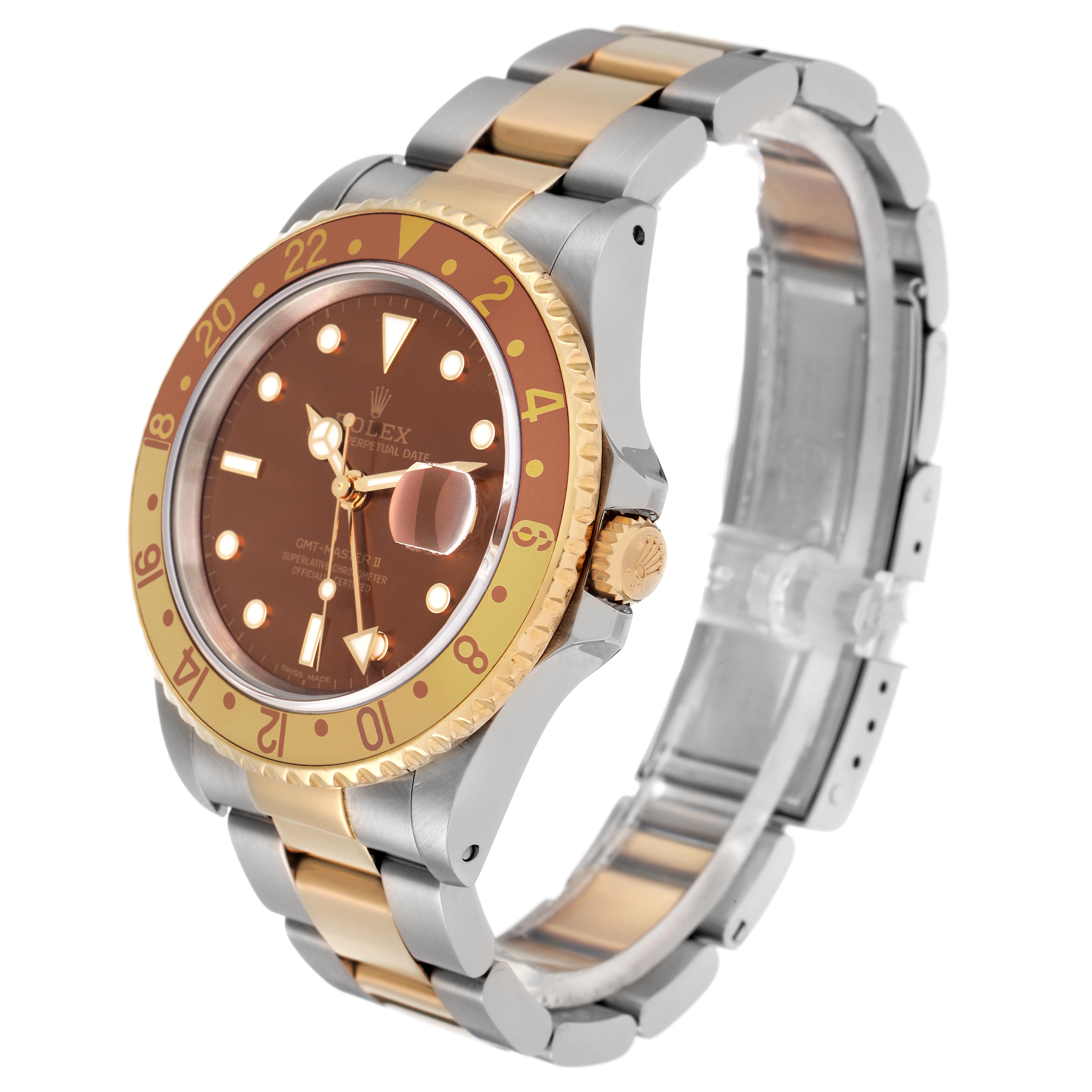 The Rolex GMT-Master 16713 Men's Steel and Gold (two tone) Brown Dial 16713 Men's Steel and Gold (two tone) Brown Dial watch is shown at a three-quarter angle, highlighting the dial, bezel, crown, and bracelet.