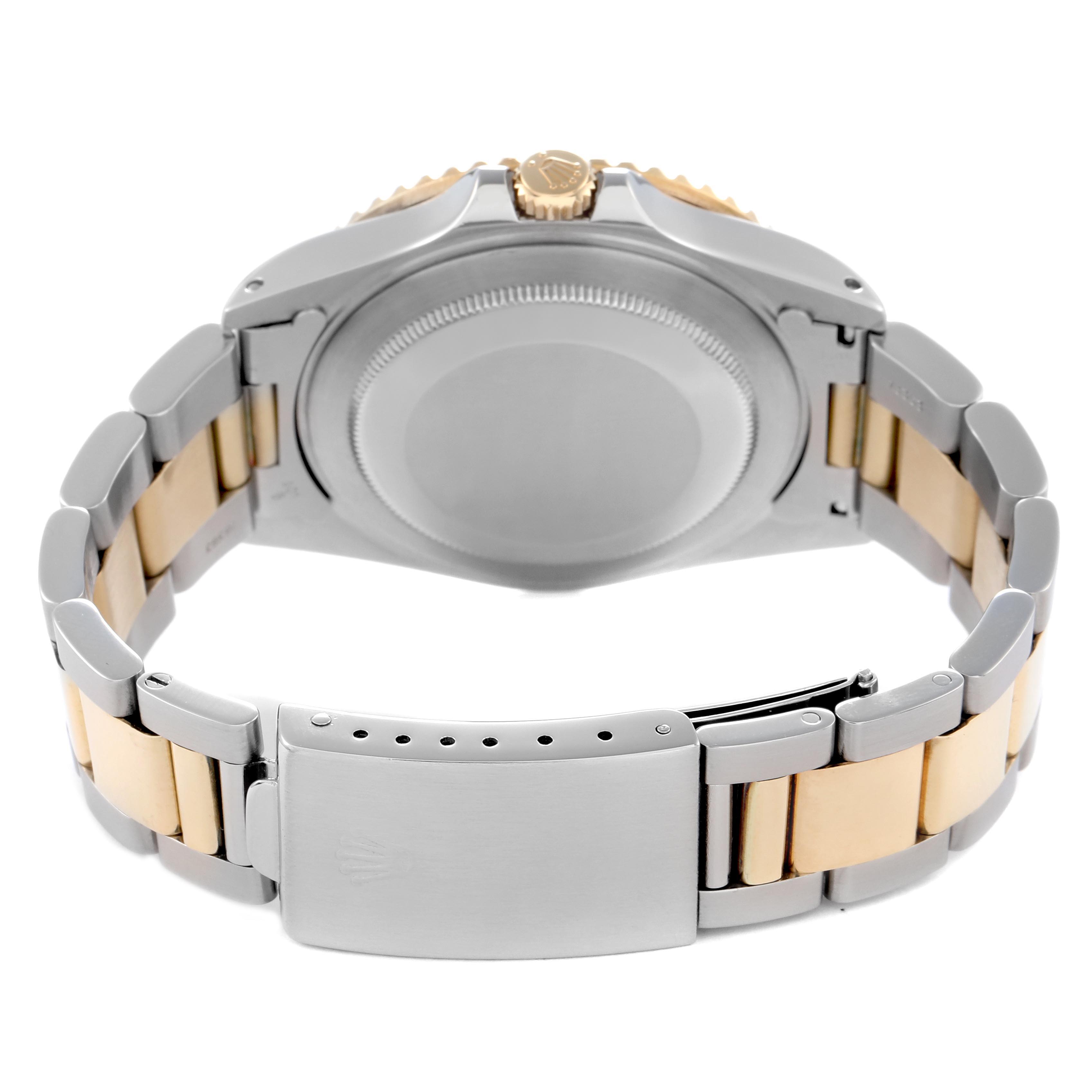 The image shows the back view of a Rolex GMT-Master 16713 Men's Steel and Gold (two tone) Brown Dial 16713 Men's Steel and Gold (two tone) Brown Dial watch, highlighting the case back and two-tone bracelet with clasp.