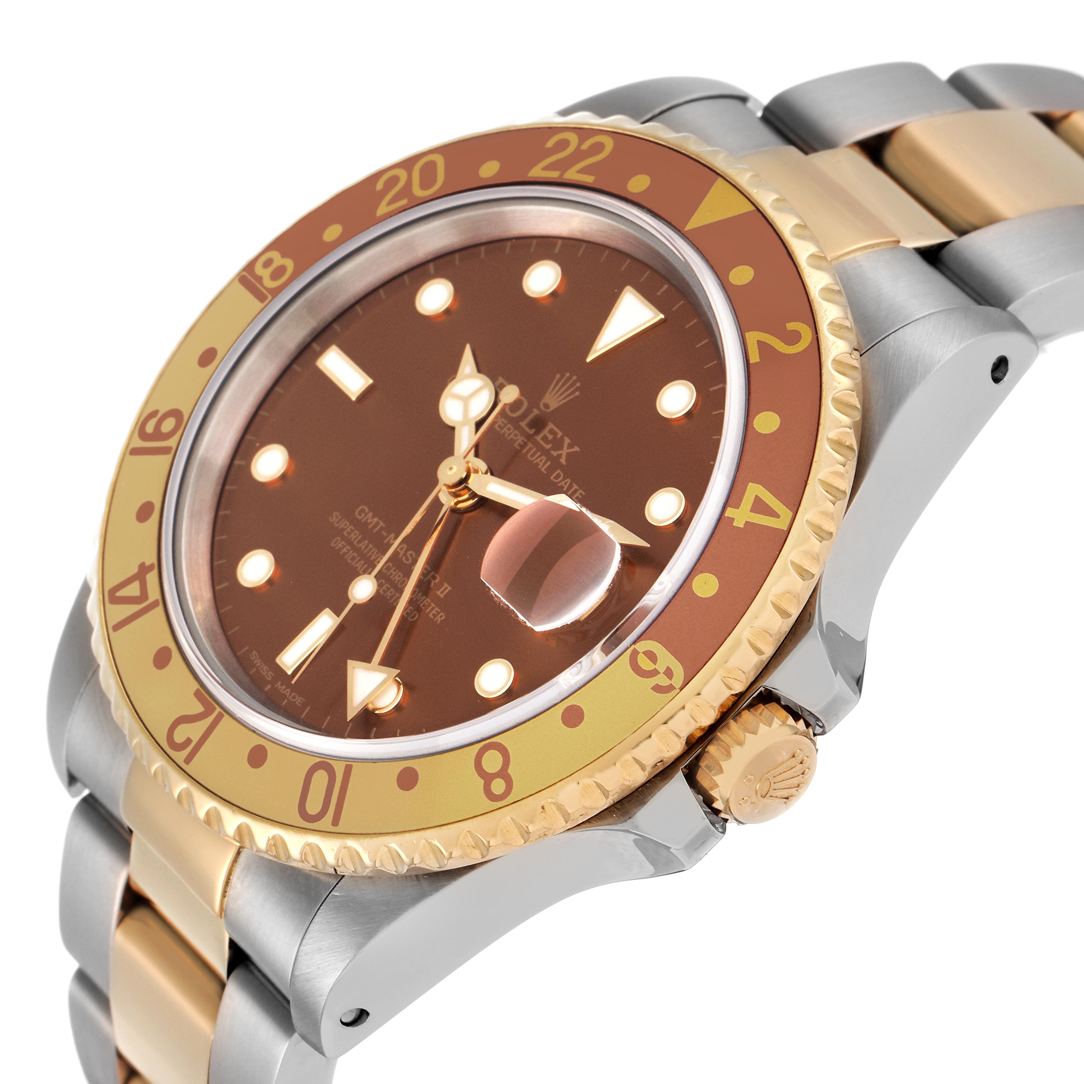 The Rolex GMT-Master 16713 Men's Steel and Gold (two tone) Brown Dial 16713 Men's Steel and Gold (two tone) Brown Dial watch is shown at an angle displaying the dial, bezel, crown, and bracelet links.