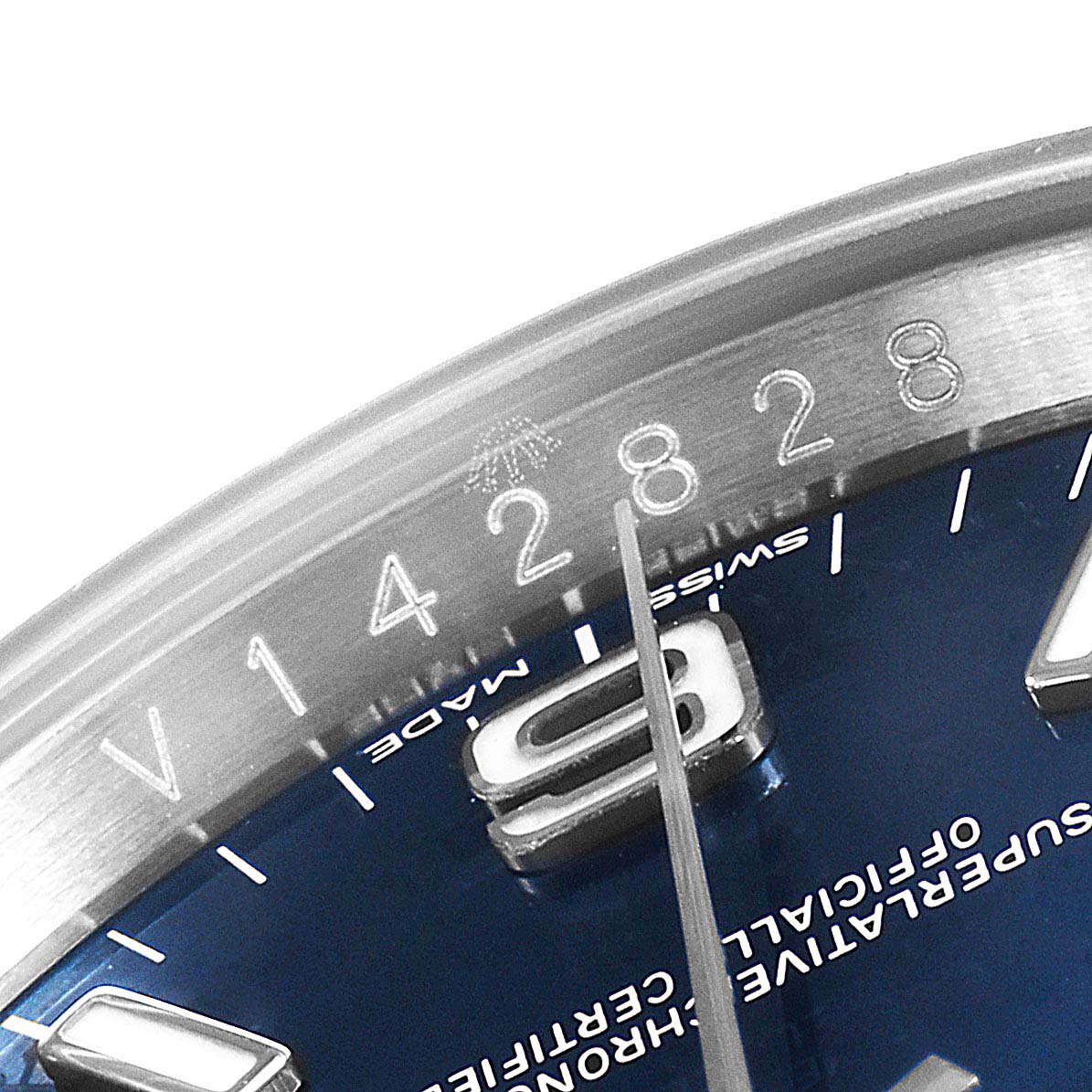 The image shows a close-up of the dial and bezel of the Rolex Oyster Perpetual 116034 Men's Stainless Steel Blue Dial 116034 Men's Stainless Steel Blue Dial watch, highlighting the numbers and part of the text.