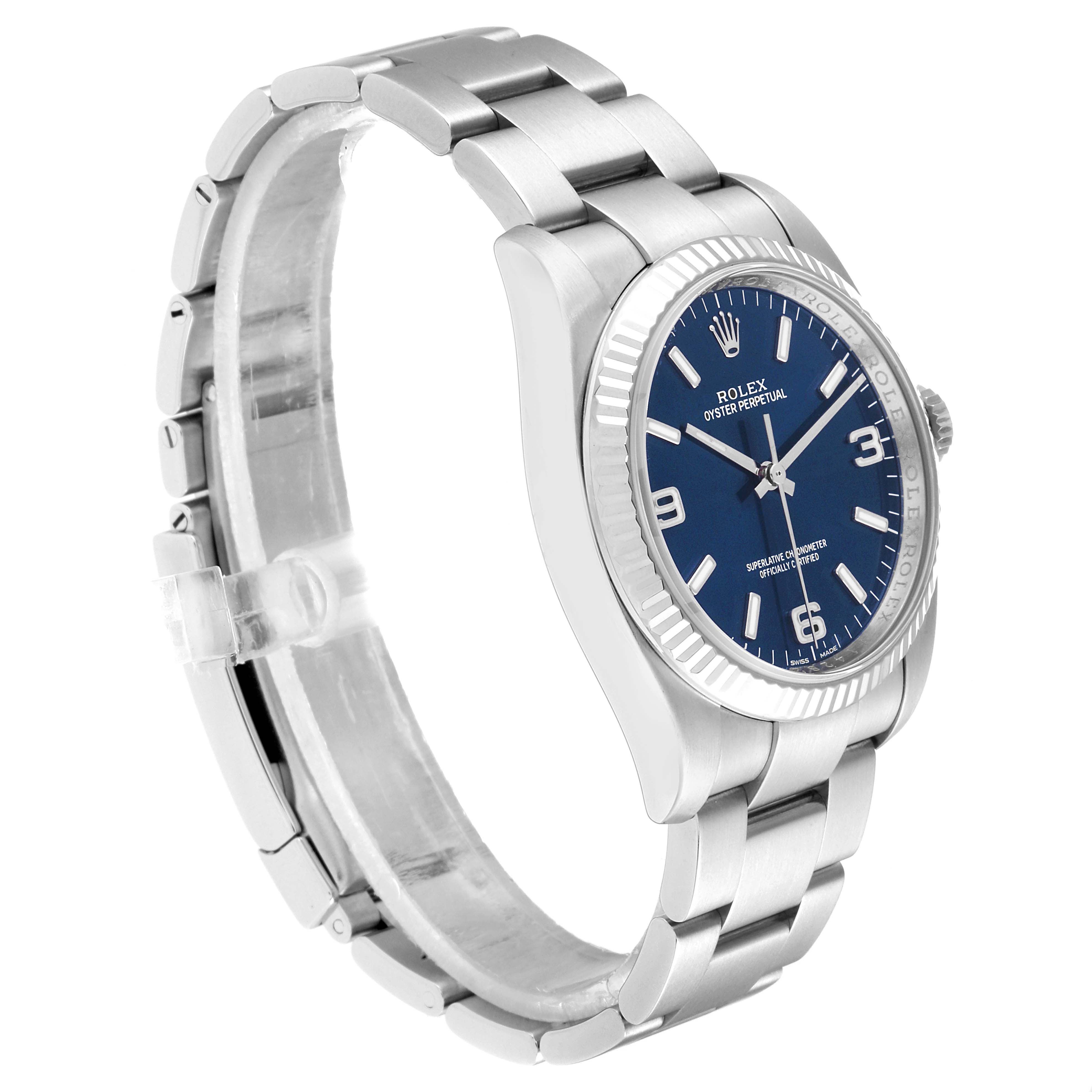 The Rolex Oyster Perpetual 116034 Men's Stainless Steel Blue Dial 116034 Men's Stainless Steel Blue Dial watch is shown at an angle displaying the bracelet, case, and blue dial.