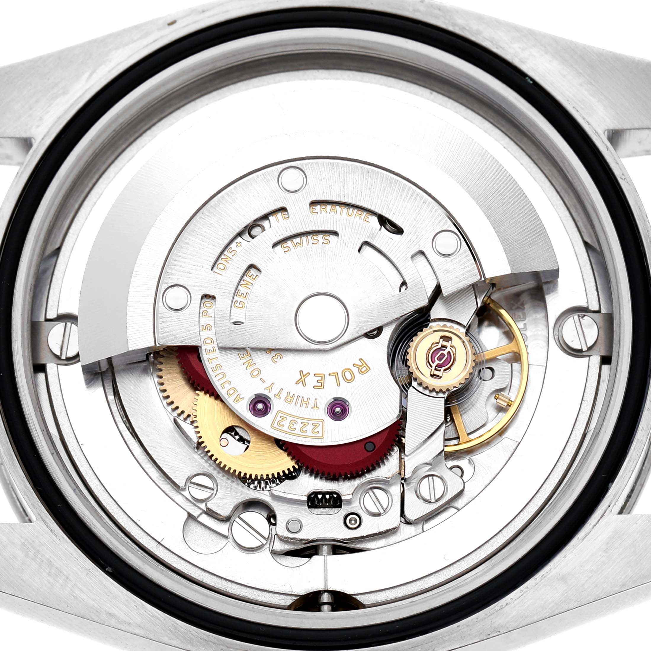The image shows the open back of an Oyster Perpetual by Rolex, highlighting the intricate movement mechanisms inside.