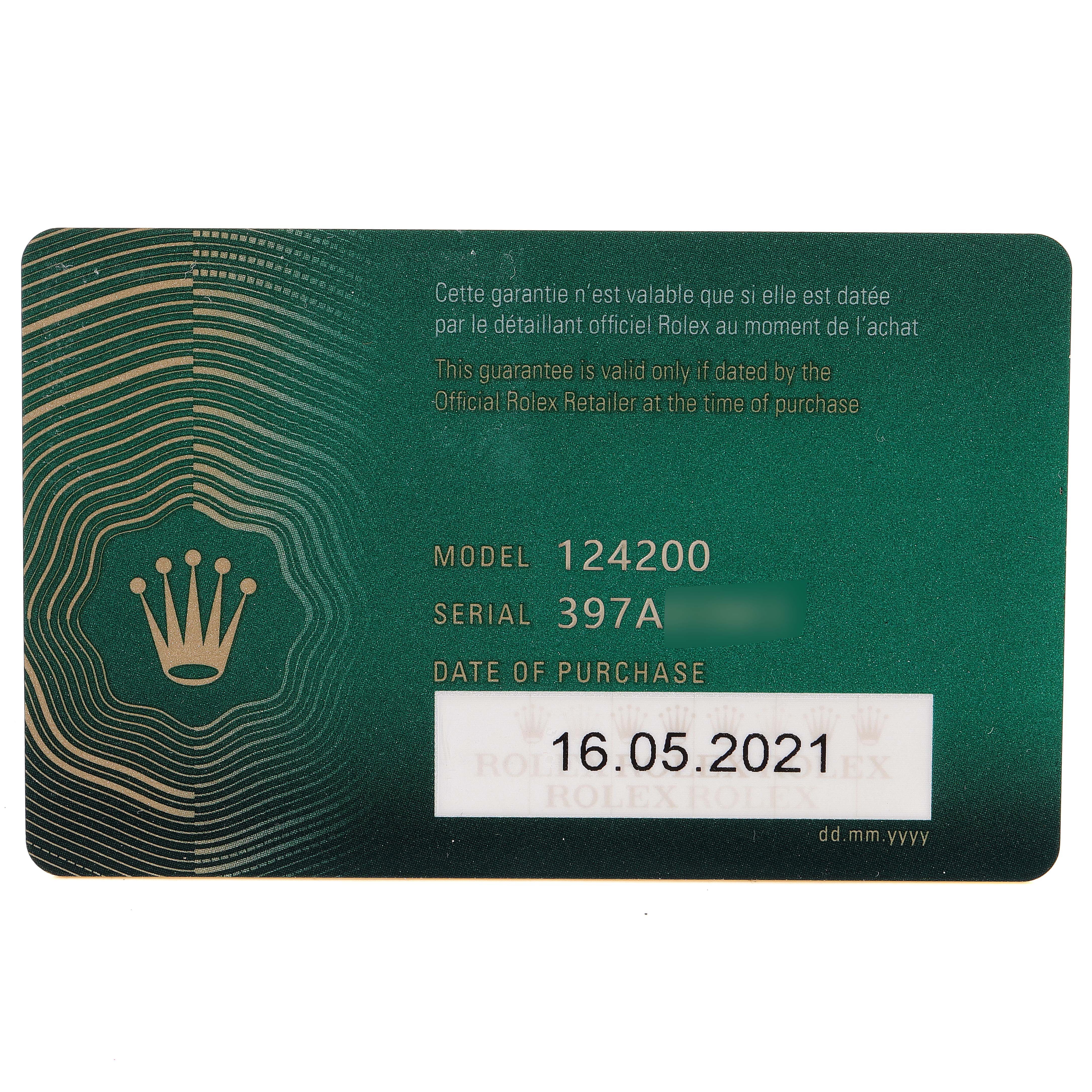 This image shows a green Rolex warranty card for the Oyster Perpetual model 124200, including the serial number and purchase date.