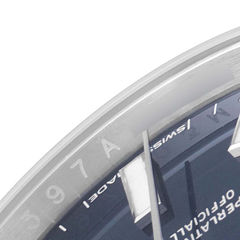 This image shows a close-up of the dial and part of the bezel of a Rolex Oyster Perpetual 124200 Men
s Stainless Steel Blue Dial 124200 Men
s Stainless Steel Blue Dial watch.