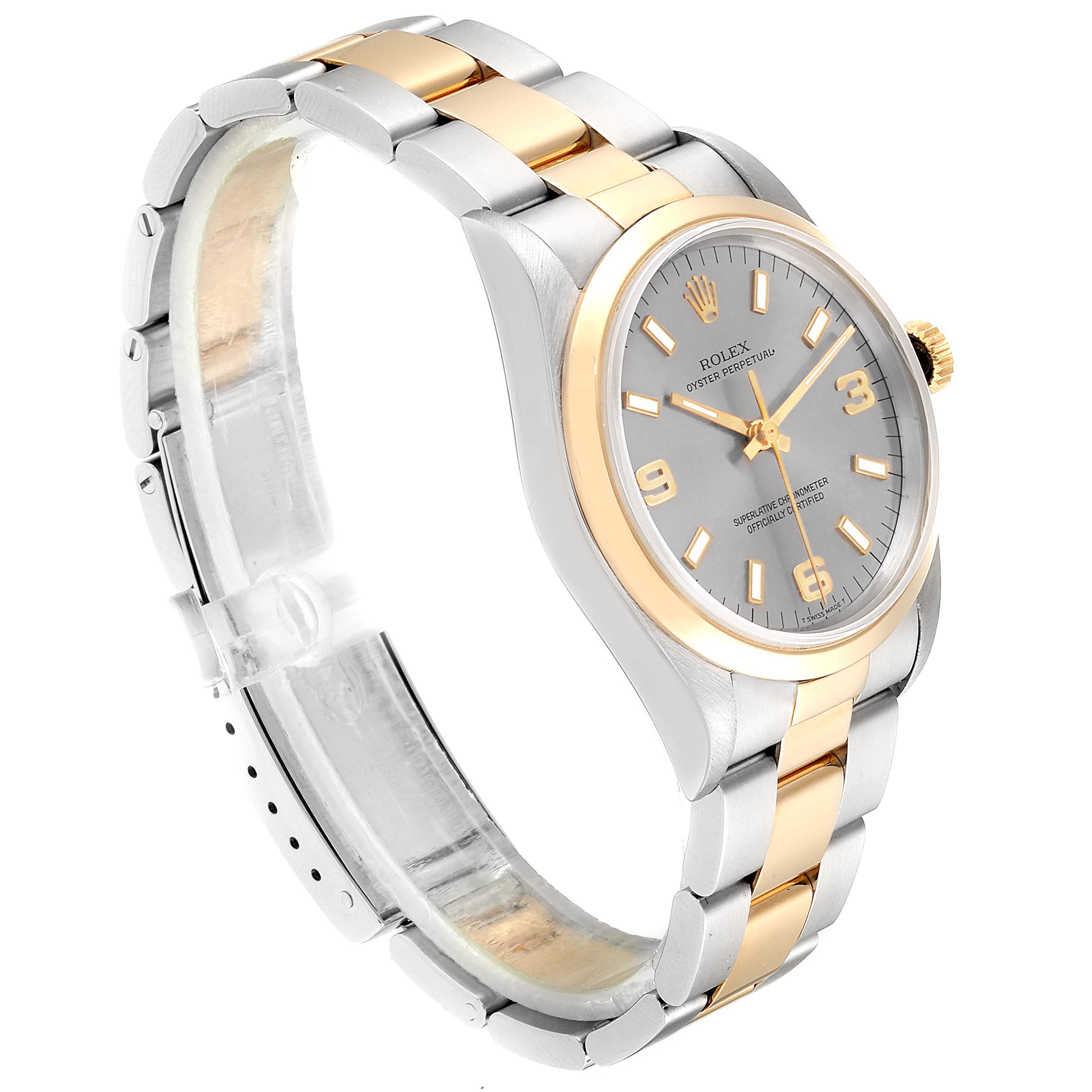 This image shows a Rolex Oyster Perpetual 14203 Men's Steel and Gold (two tone) Grey Dial 14203 Men's Steel and Gold (two tone) Grey Dial watch at a slight side angled view, highlighting its two-tone bracelet and dial.