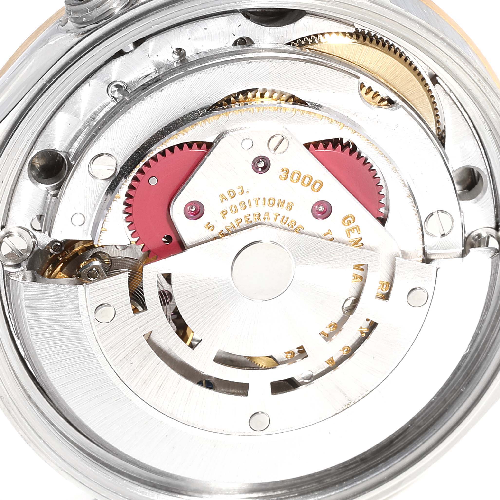 This image shows the inner mechanical movement of a Rolex Oyster Perpetual 14203 Men's Steel and Gold (two tone) Grey Dial 14203 Men's Steel and Gold (two tone) Grey Dial watch, highlighting gears and components.
