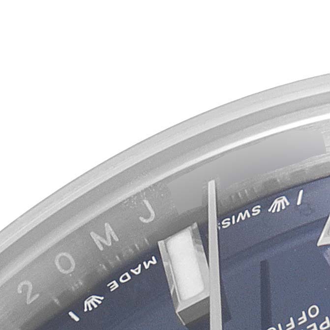 The image shows a close-up of the Rolex Oyster Perpetual 276200 Women
s Stainless Steel Blue Dial 276200 Women
s Stainless Steel Blue Dial watch face, including a portion of the dial and indices.