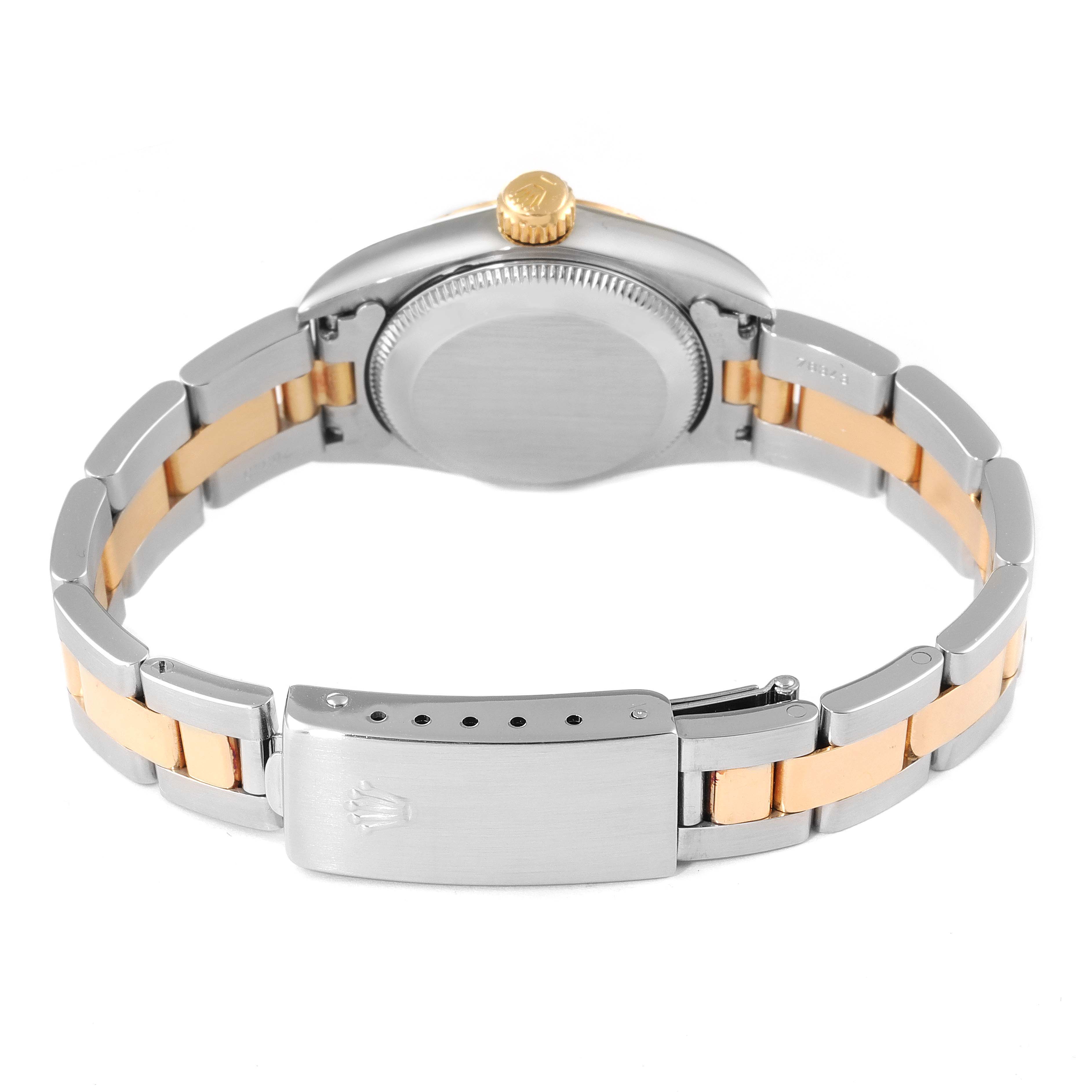 The image shows the back view of a Rolex Oyster Perpetual 67243 Women's Steel and Gold (two tone) White Dial 67243 Women's Steel and Gold (two tone) White Dial watch, highlighting the clasp, bracelet, case back, and crown.