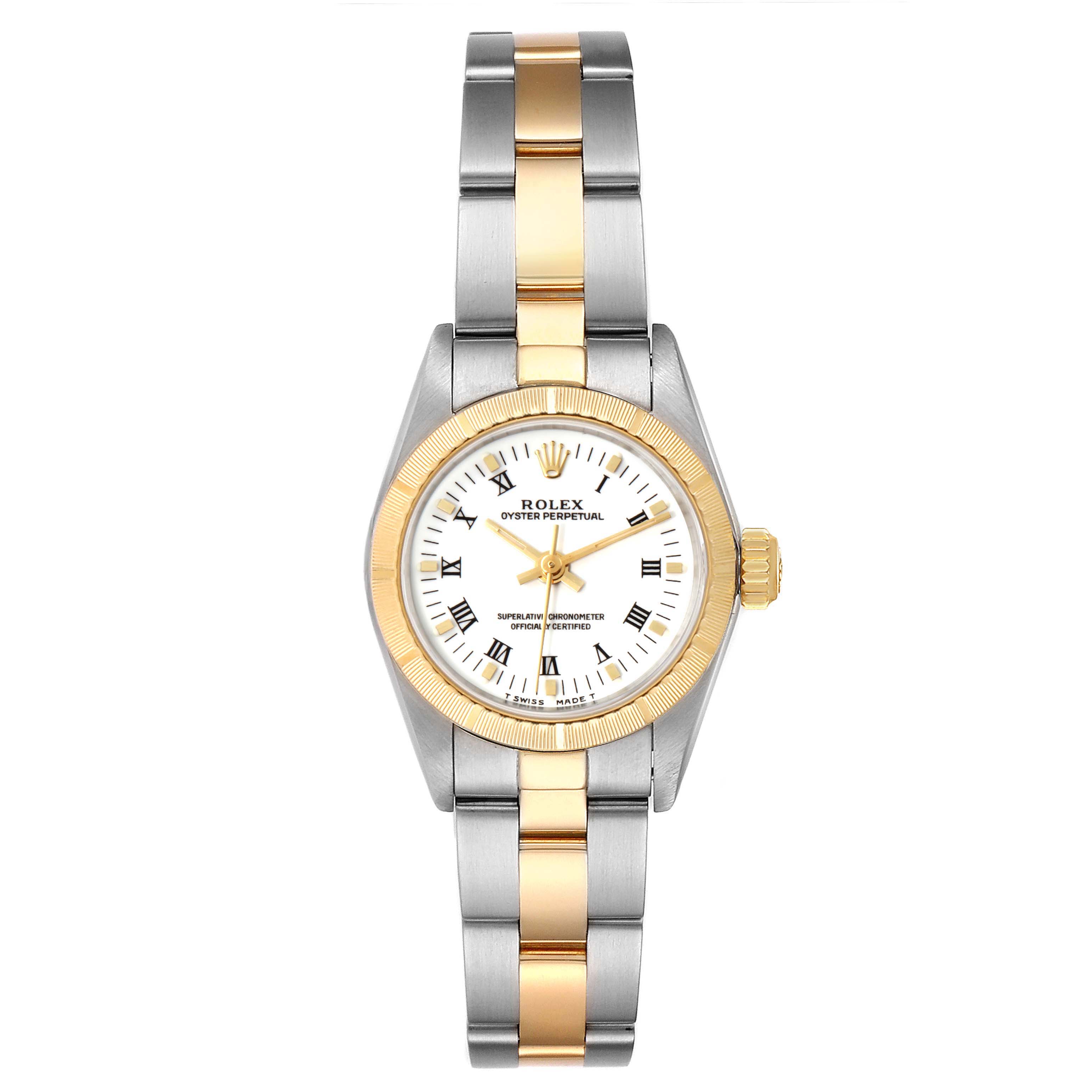 The Rolex Oyster Perpetual 67243 Women's Steel and Gold (two tone) White Dial 67243 Women's Steel and Gold (two tone) White Dial watch is shown from a front angle, highlighting its two-tone bracelet, white dial, and gold bezel.