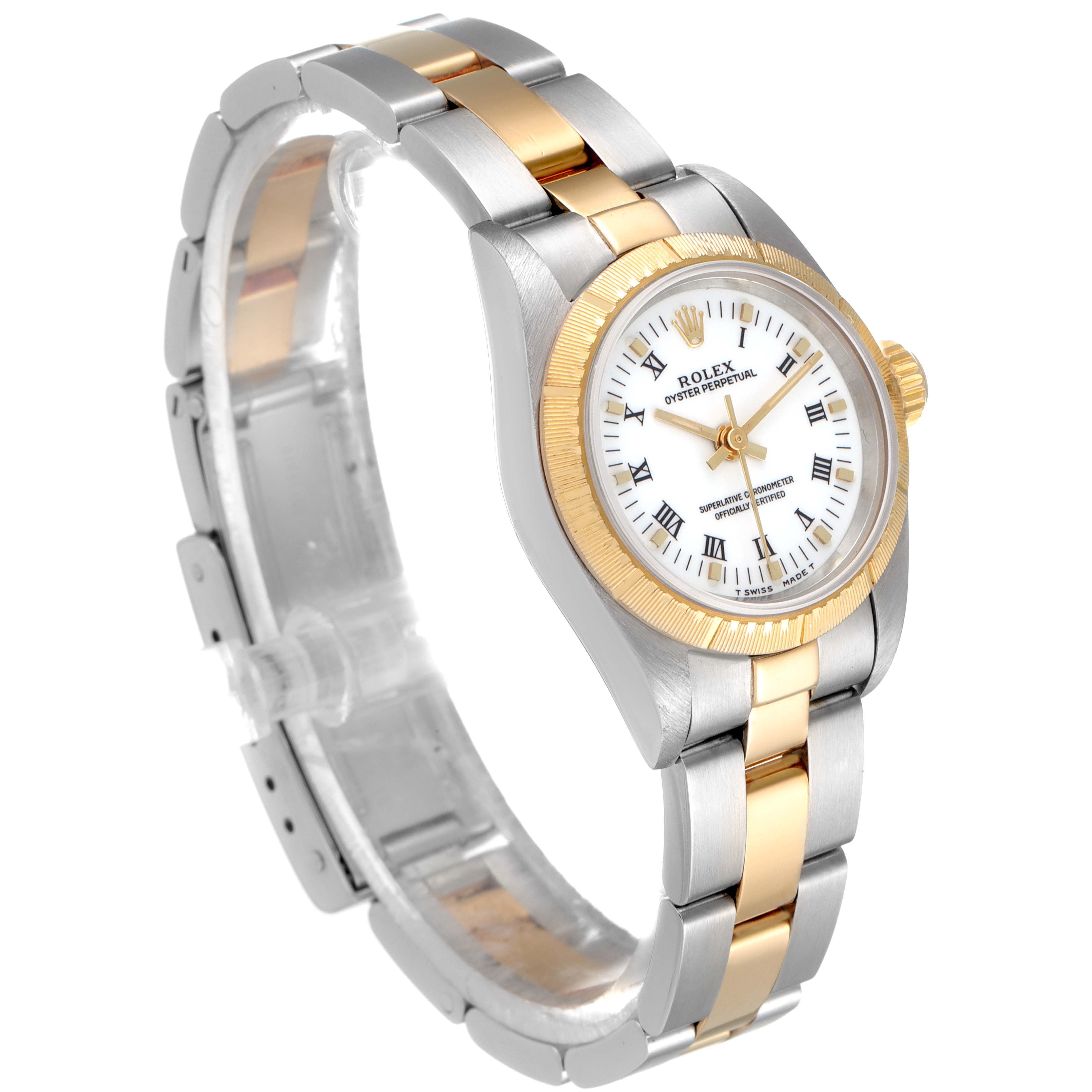 This image shows a Rolex Oyster Perpetual 67243 Women's Steel and Gold (two tone) White Dial 67243 Women's Steel and Gold (two tone) White Dial watch at an angle, highlighting its gold and silver bracelet and the watch's face.
