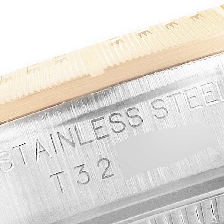 The image shows a close-up of the side engraving on the case of a Rolex Oyster Perpetual 67243 Women's Steel and Gold (two tone) White Dial 67243 Women's Steel and Gold (two tone) White Dial watch.