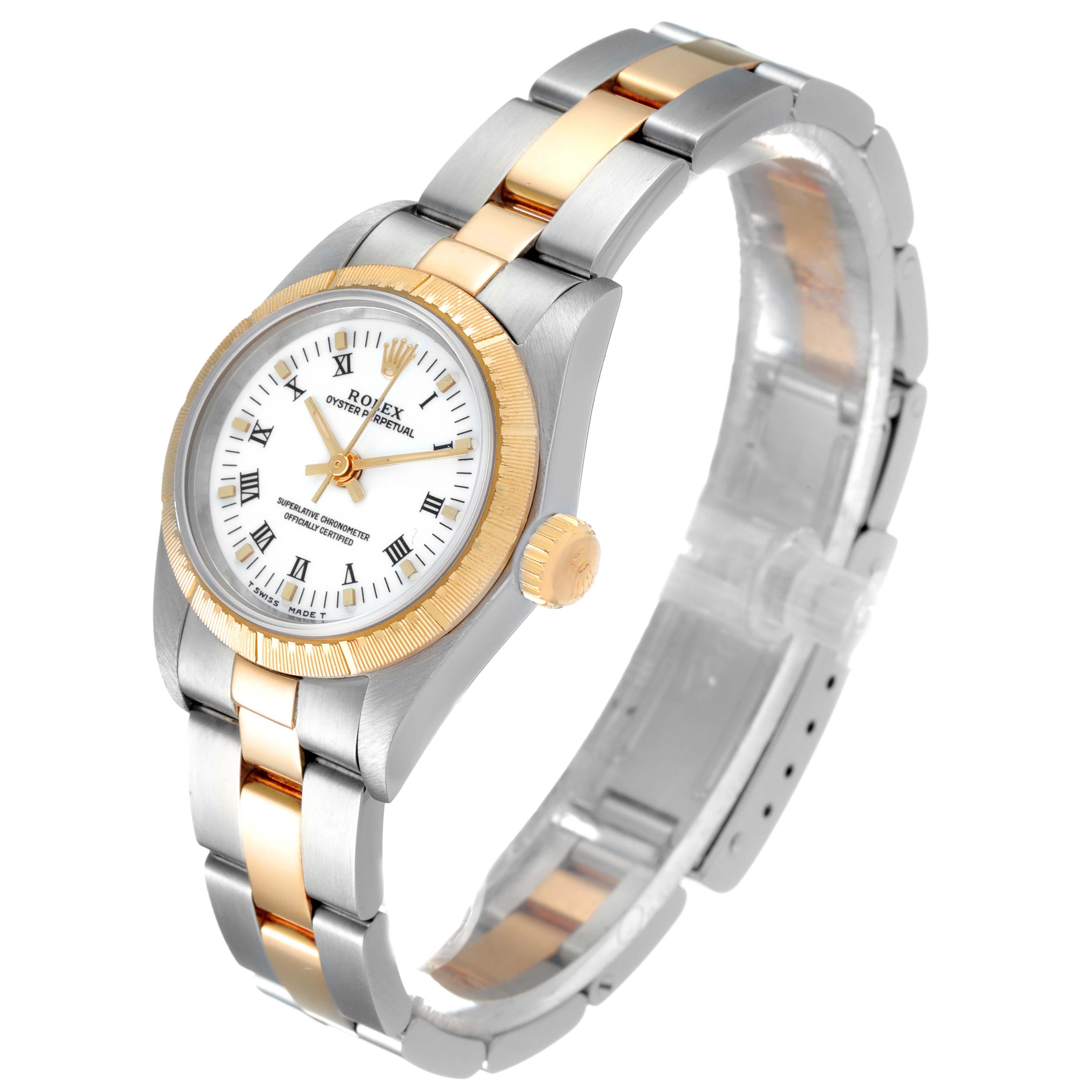 The image shows a side-angle view of a Rolex Oyster Perpetual 67243 Women's Steel and Gold (two tone) White Dial 67243 Women's Steel and Gold (two tone) White Dial watch, highlighting the case, dial, crown, and two-tone bracelet.