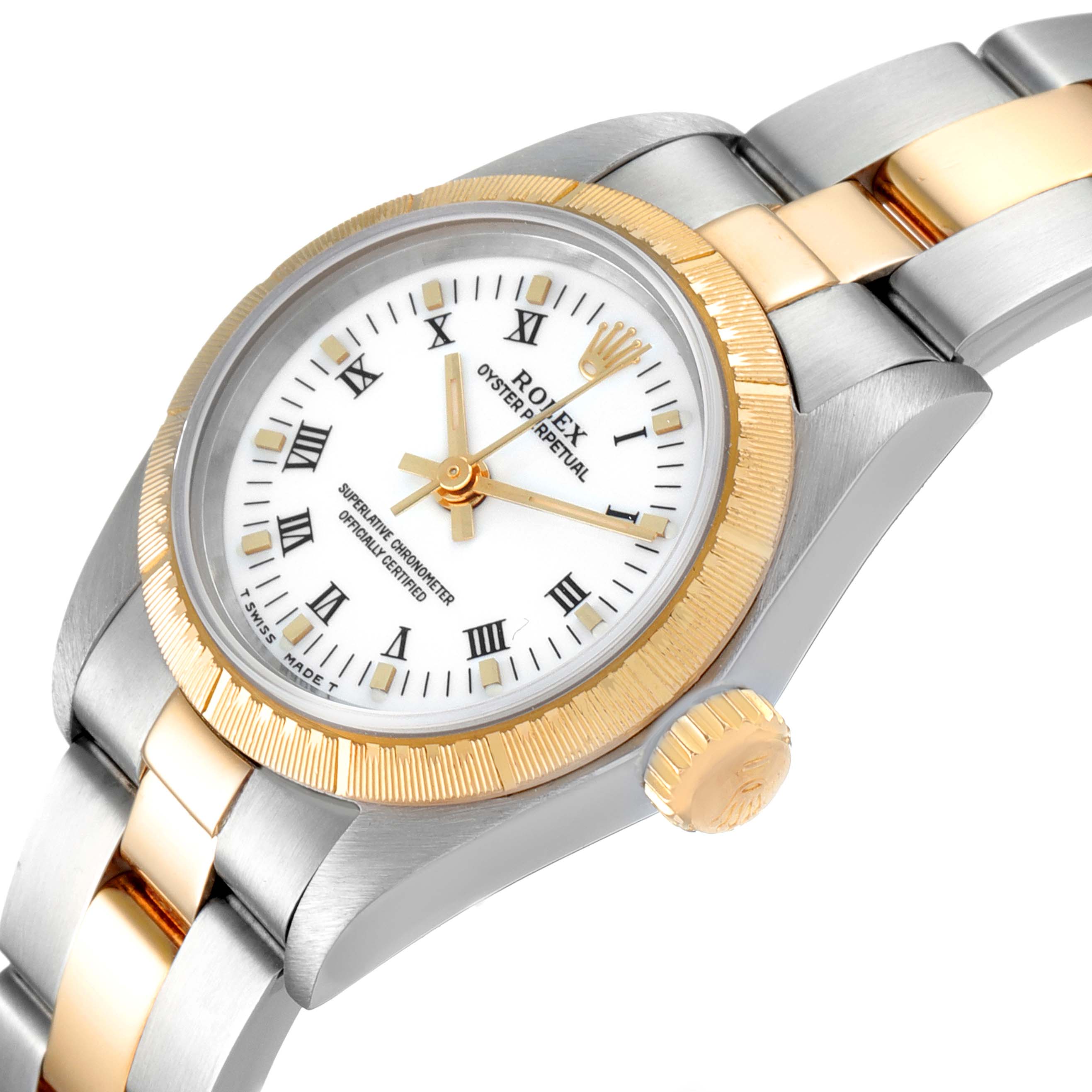 The image shows a Rolex Oyster Perpetual 67243 Women's Steel and Gold (two tone) White Dial 67243 Women's Steel and Gold (two tone) White Dial watch at an angle, highlighting the face, bezel, crown, and part of the bracelet.