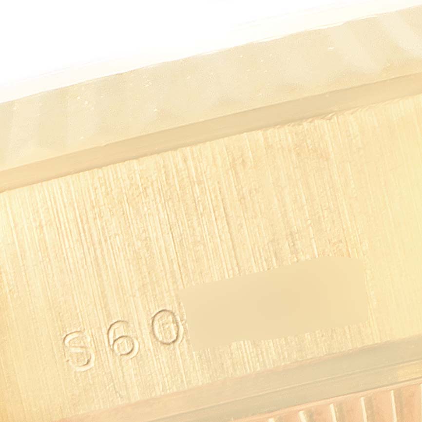 The image shows a close-up of the Rolex President 69178 Women's Yellow Gold Black Dial 69178 Women's Yellow Gold Black Dial model watch case side with partial serial marking "860."