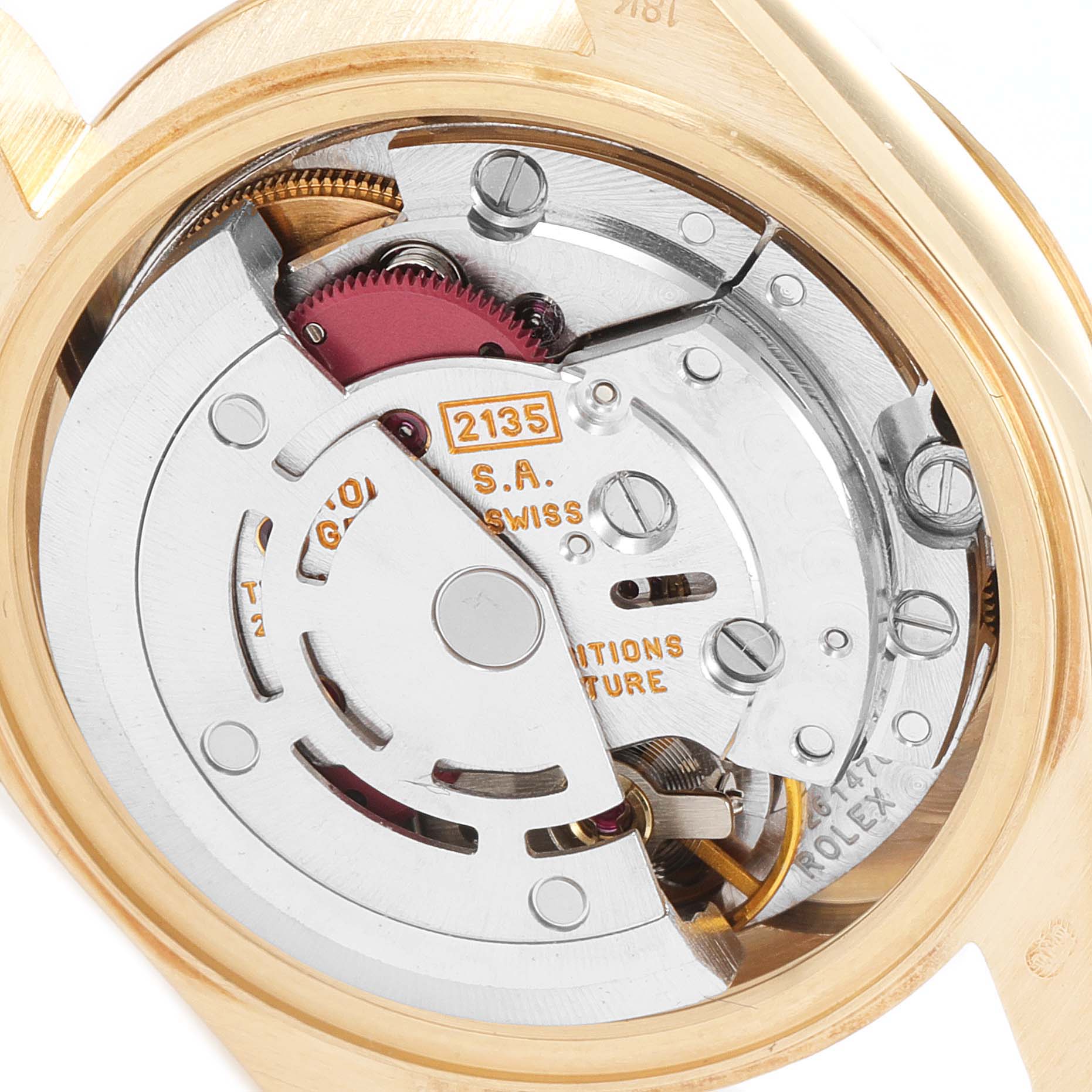 The image shows a close-up of the movement mechanism of a Rolex President 69178 Women's Yellow Gold Black Dial 69178 Women's Yellow Gold Black Dial model watch.