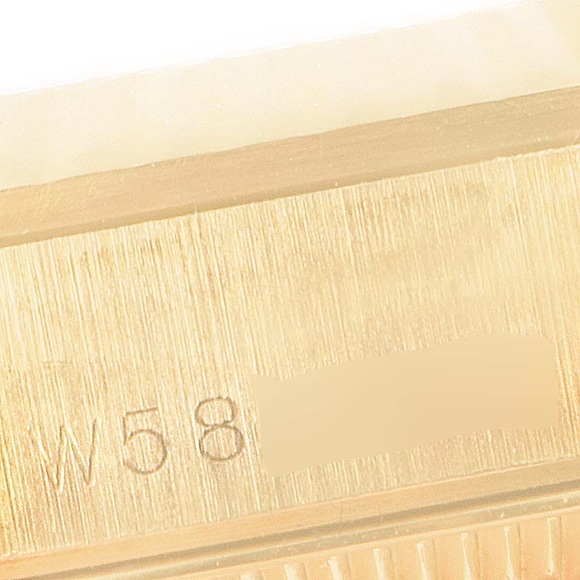 This close-up image shows the serial number area on the side of the Rolex President 68278 Women
s Yellow Gold Champagne Dial 68278 Women
s Yellow Gold Champagne Dial model watch case.