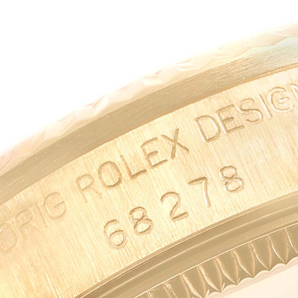 This close-up image of a Rolex President 68278 Women
s Yellow Gold Champagne Dial 68278 Women
s Yellow Gold Champagne Dial watch shows the engraved model number "68278" on the casing.