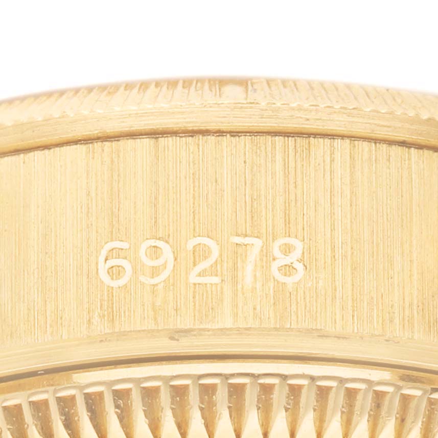 The image shows a close-up of the case band edge, featuring the reference number of the Rolex President 69278 Women's Yellow Gold Champagne Dial model.