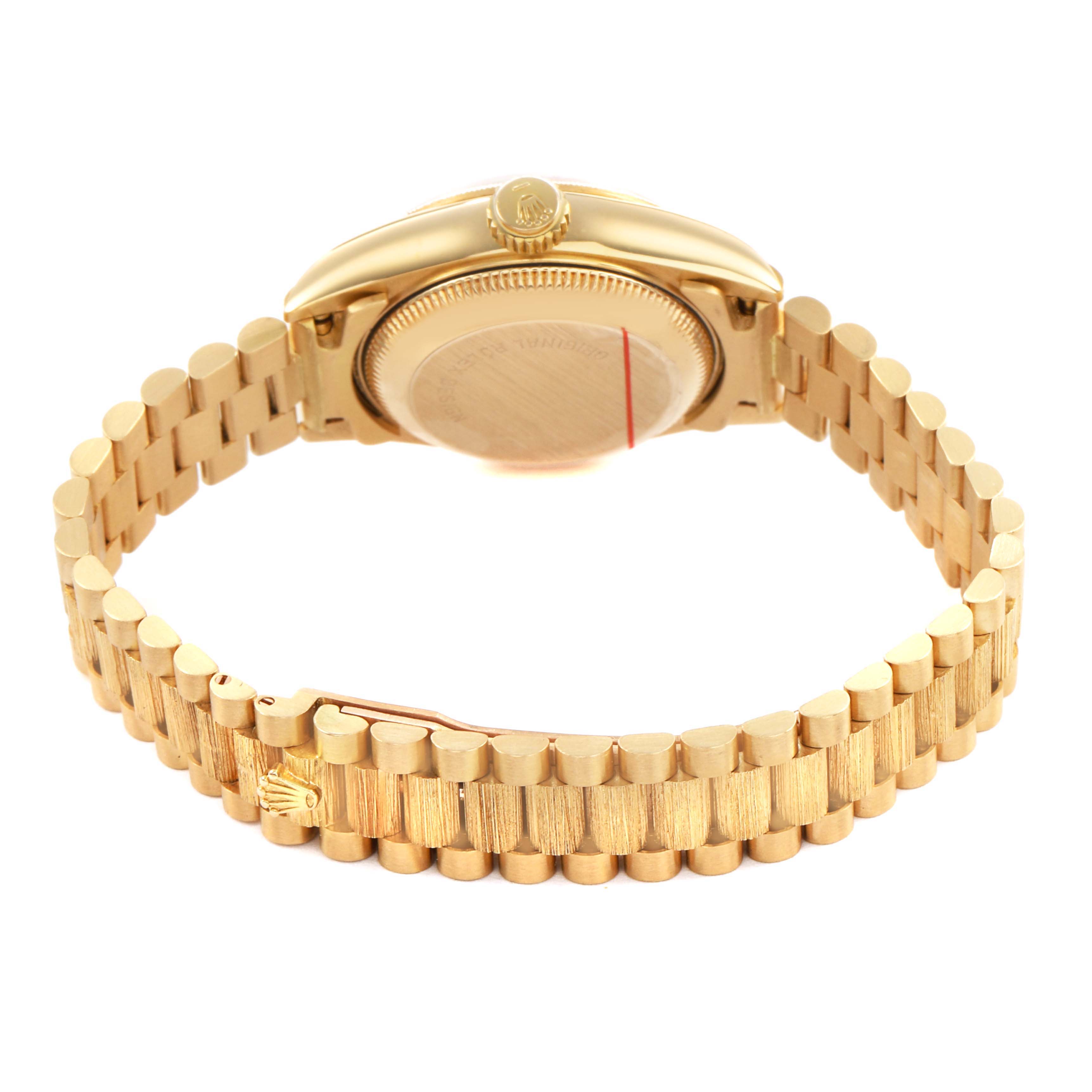 The image shows the back and side view of a Rolex President 69278 Women's Yellow Gold Champagne Dial model, highlighting its gold bracelet and watch crown.