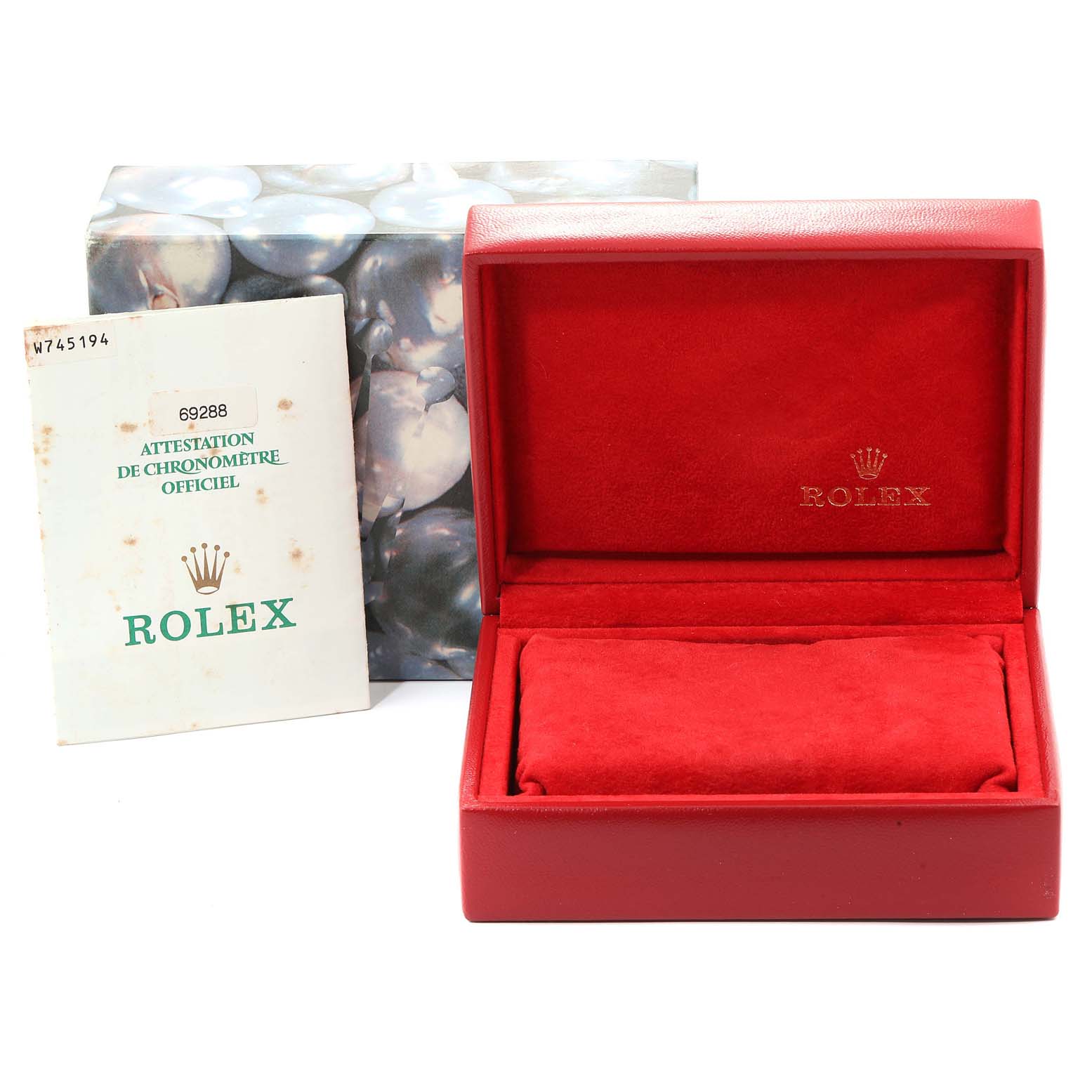 The image shows a Rolex President 69288 Women
s Yellow Gold Champagne Dial 69288 Women
s Yellow Gold Champagne Dial model box and an official chronometer certification booklet.