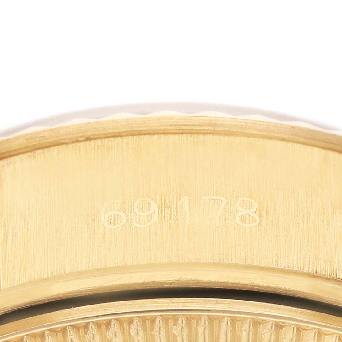 The image shows a close-up of the gold case side of a Rolex President 69178 Womens Yellow Gold Yellow Dial model, highlighting the engraved model number.