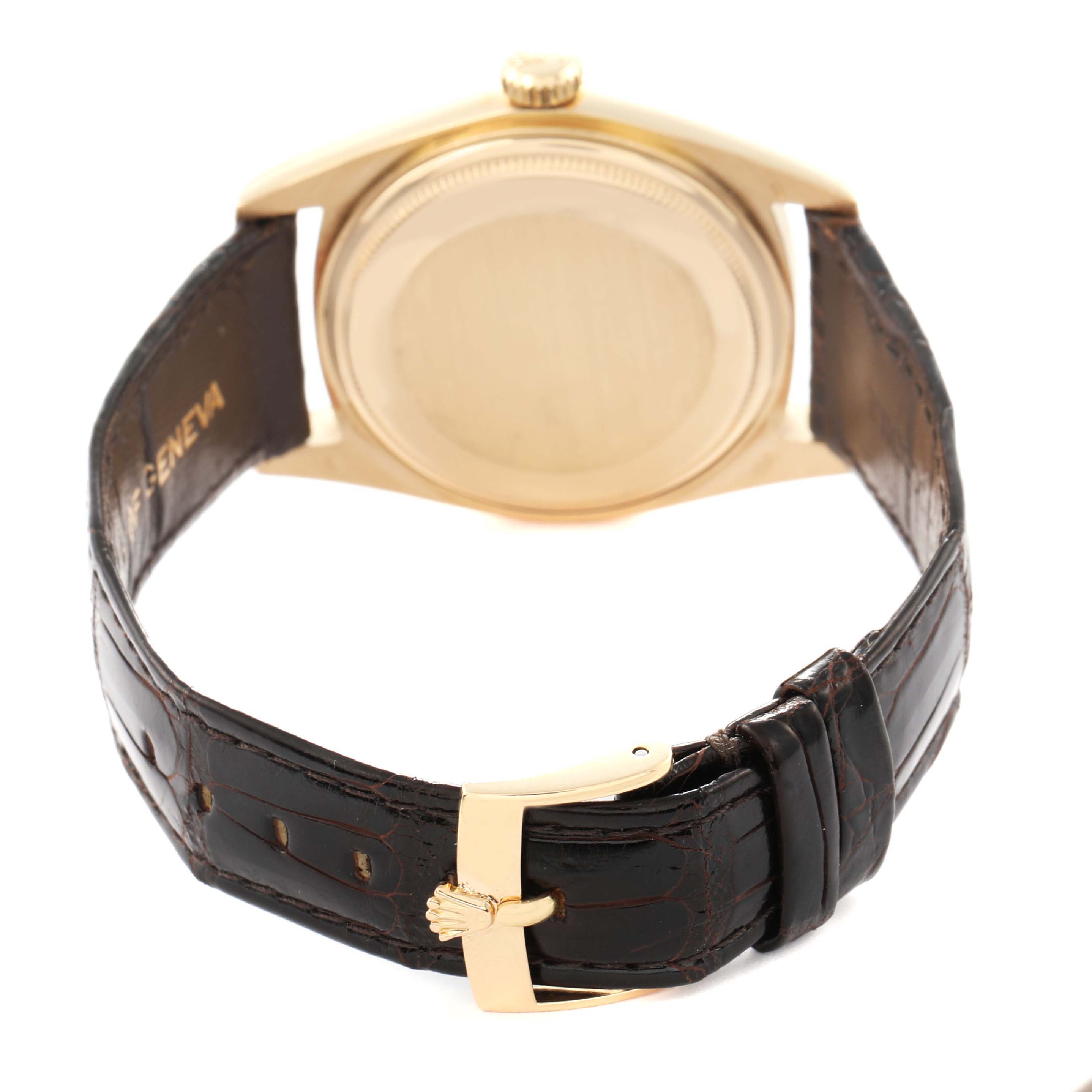 The image shows the back and strap of a Rolex President 1803 Men
s Yellow Gold Champagne Dial 1803 Men
s Yellow Gold Champagne Dial model watch, highlighting the clasp and caseback.