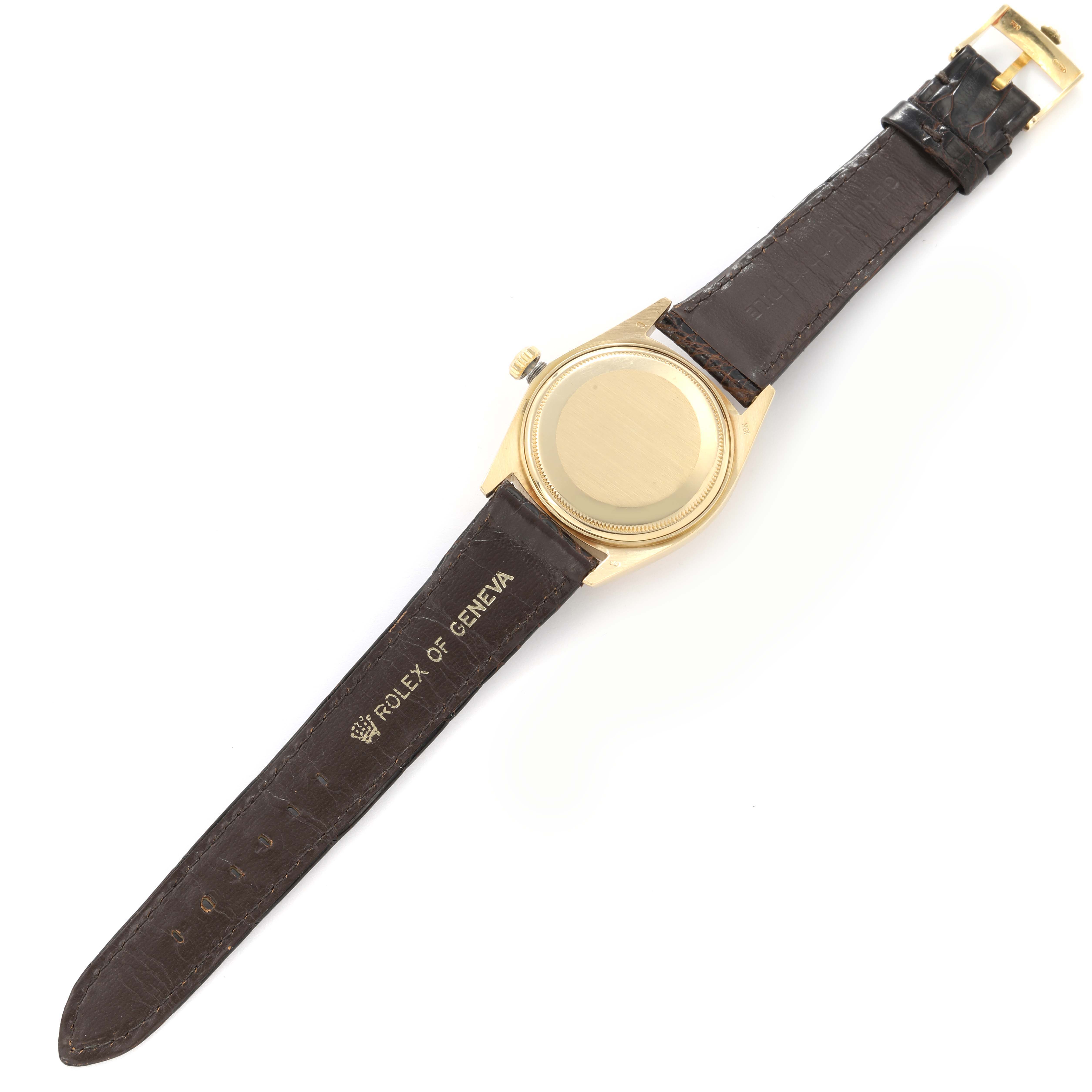 The Rolex President 1803 Men
s Yellow Gold Champagne Dial 1803 Men
s Yellow Gold Champagne Dial model watch is shown from the back, displaying the case and leather strap.