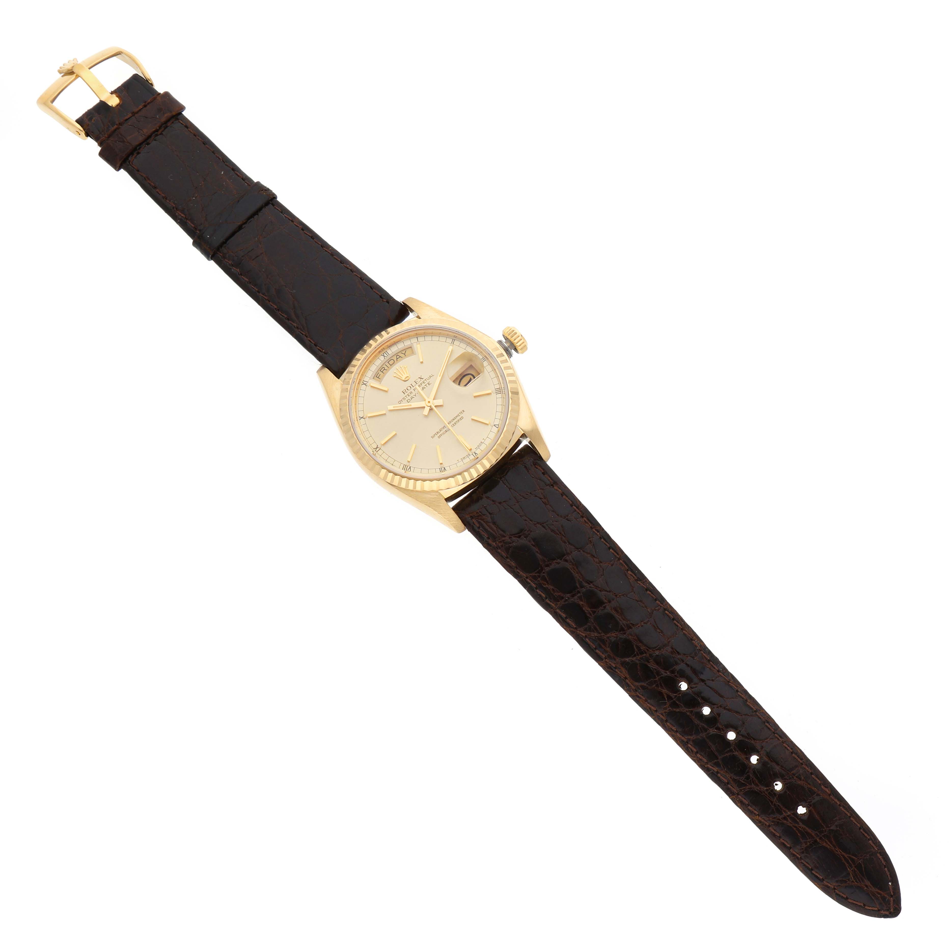 The Rolex President 18038 Men's Yellow Gold Champagne Dial watch is shown from a top-down angle, highlighting its dial, bezel, strap, and buckle.