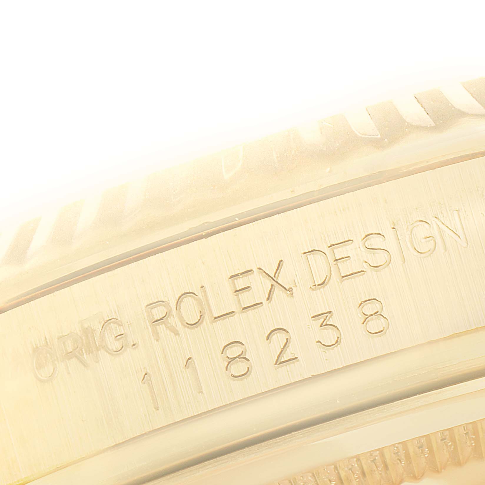 The image shows a close-up view of the engraved serial number and branding on the case side of the Rolex President 118238 Men
s Yellow Gold Black Dial 118238 Men
s Yellow Gold Black Dial model watch.