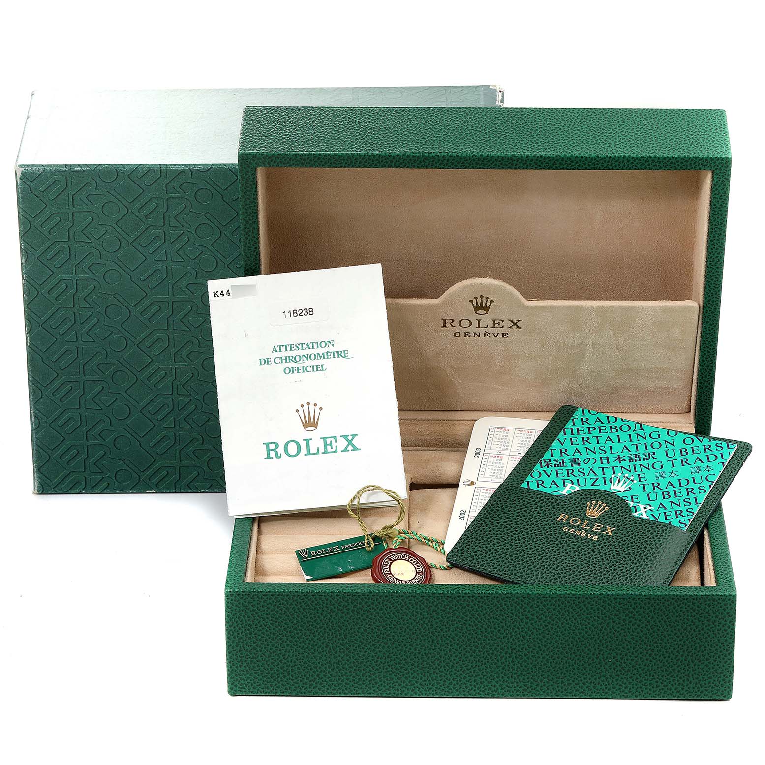 The image shows the packaging, booklets, hangtag, and warranty card of a Rolex President 118238 Men
s Yellow Gold Black Dial 118238 Men
s Yellow Gold Black Dial model watch from a front angle.