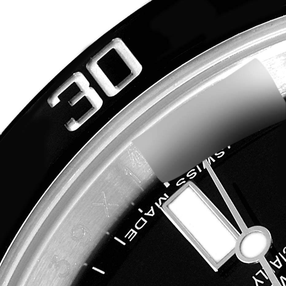 This close-up image of the Rolex Submariner 114060 Men's Stainless Steel Black Dial 114060 Men's Stainless Steel Black Dial shows part of the bezel and dial, highlighting the "30" marker and hand details.