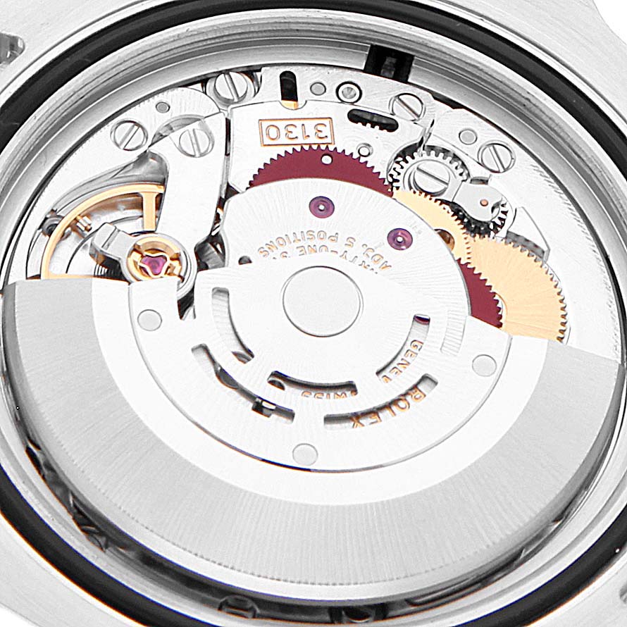 This image shows the internal mechanical movement of a Rolex Submariner 114060 Men's Stainless Steel Black Dial 114060 Men's Stainless Steel Black Dial watch, highlighting gears and components.