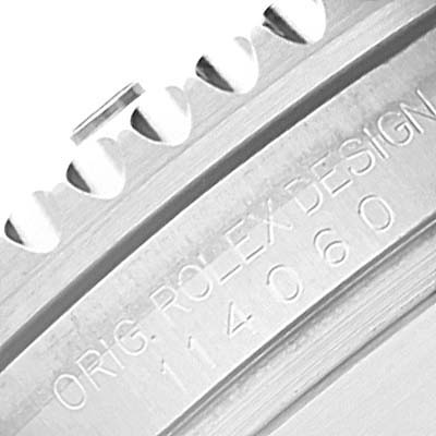 The image shows a close-up of the bezel and engraved serial number on a Rolex Submariner 114060 Men's Stainless Steel Black Dial 114060 Men's Stainless Steel Black Dial watch.