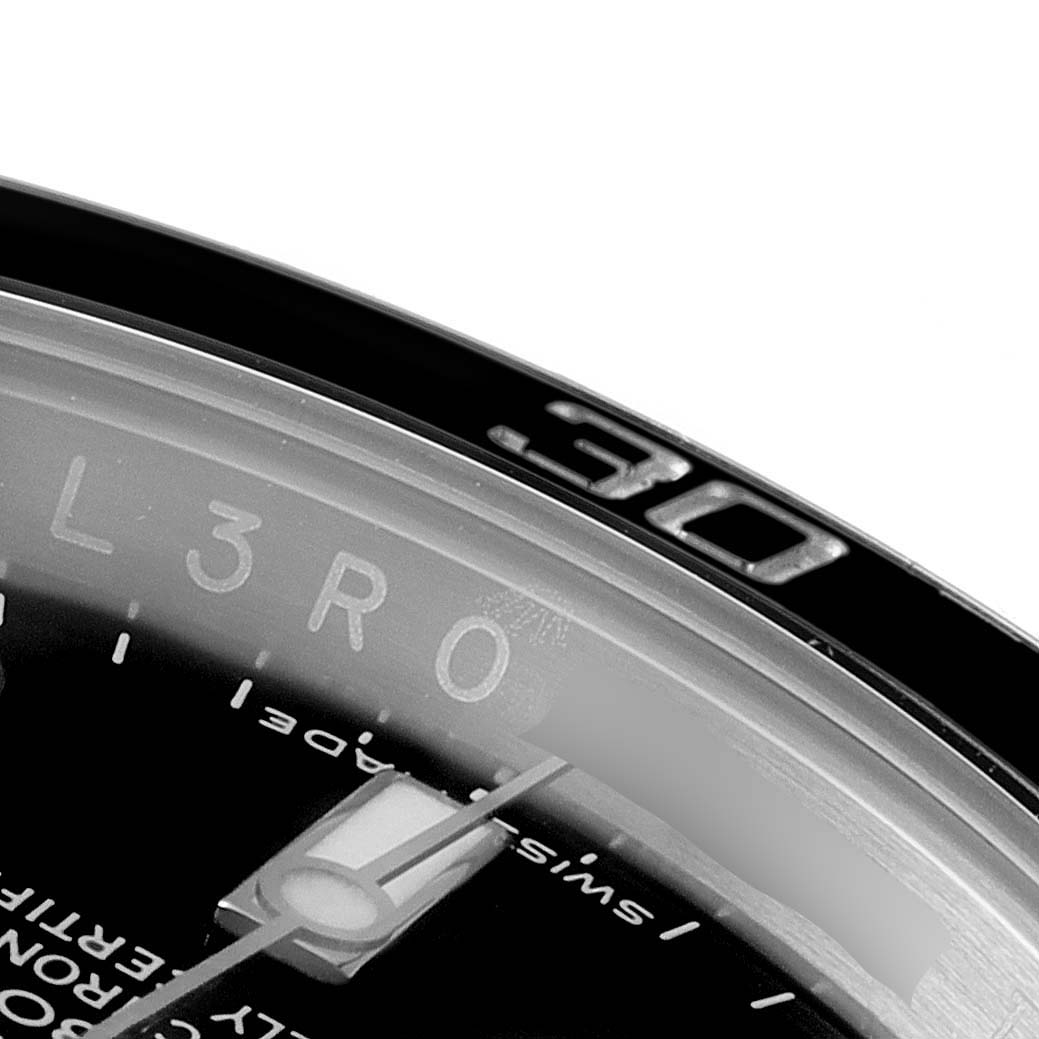This close-up image shows the bezel and part of the dial of a Rolex Submariner 116610LN Men
s Stainless Steel Black Dial 116610LN Men
s Stainless Steel Black Dial watch, focusing on the "30" marker.