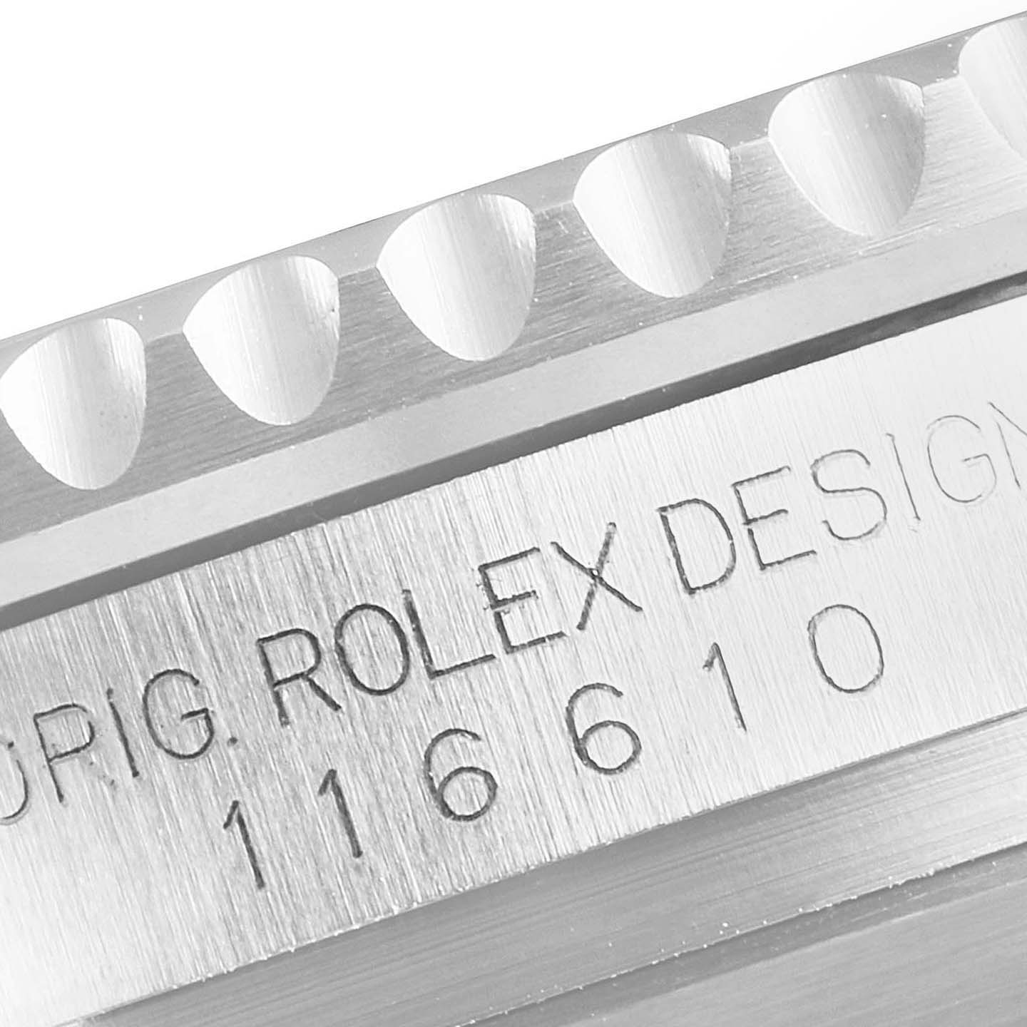 This close-up image shows a portion of the bezel and the engraved case of a Rolex Submariner 116610LN Men
s Stainless Steel Black Dial 116610LN Men
s Stainless Steel Black Dial watch.